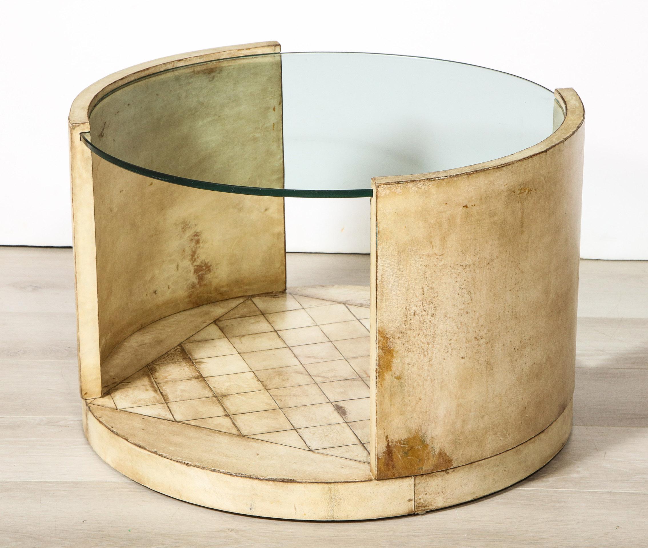 The Art Deco parchment covered low table with a glass top, open sides and square inset parchment base.