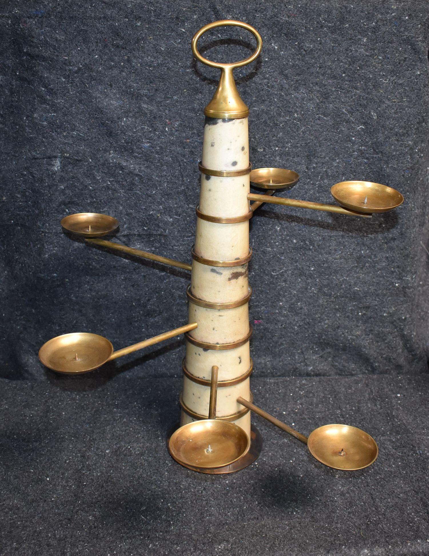 Candlestick with six brass arms (Each Arm Rotate) cover with goatskin and brass details.
Parchment is in varying shades of very light and dark gray. (High gloss polyester resin filled finish).

Additional dimension:
Diam. of extended arms: 24
