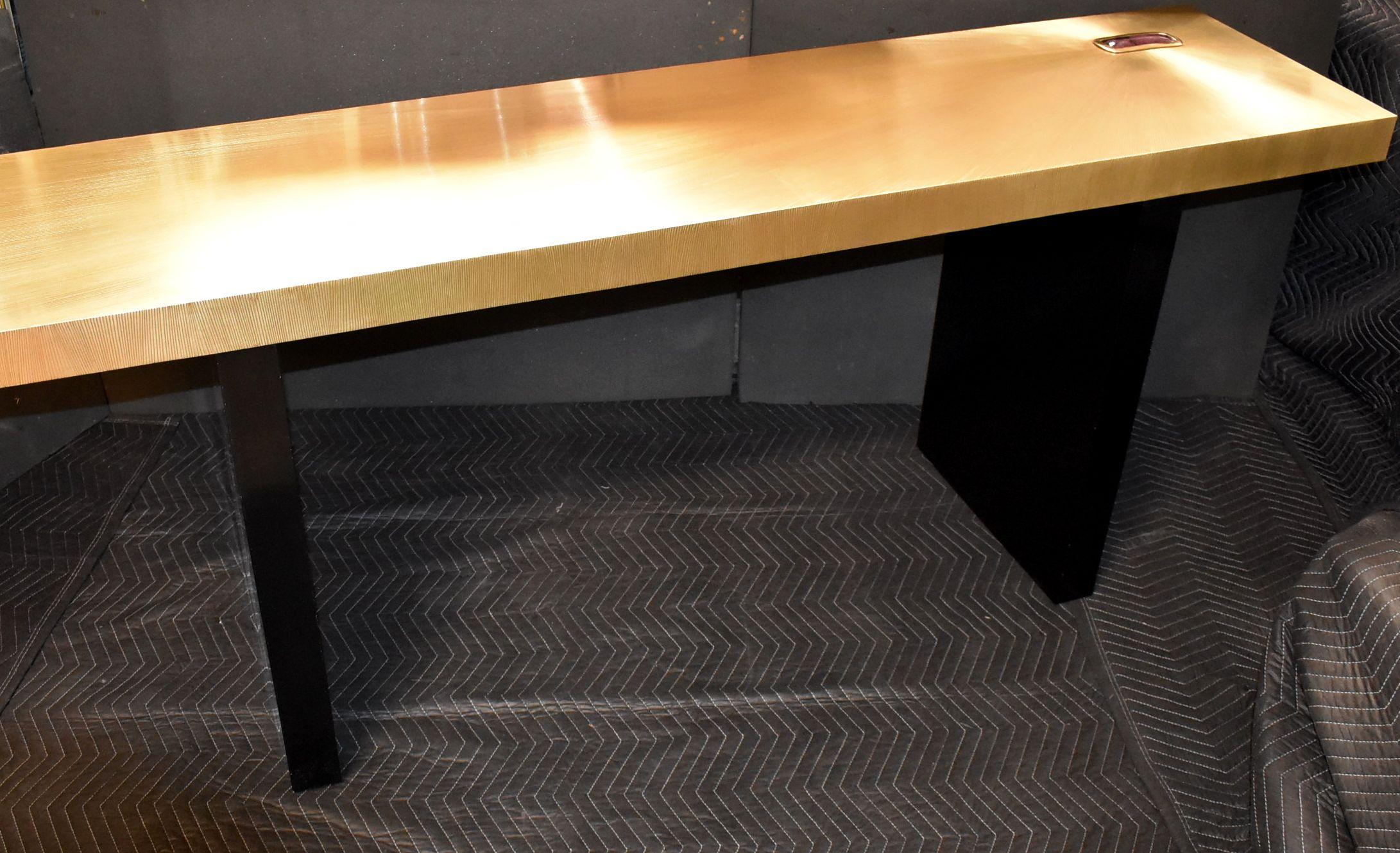 Modern solid brass-clad top with goatskin detail console table. Black painted with resin finish legs.

Please note: Two small scratches on legs see details picture and vintage finish on brass top.