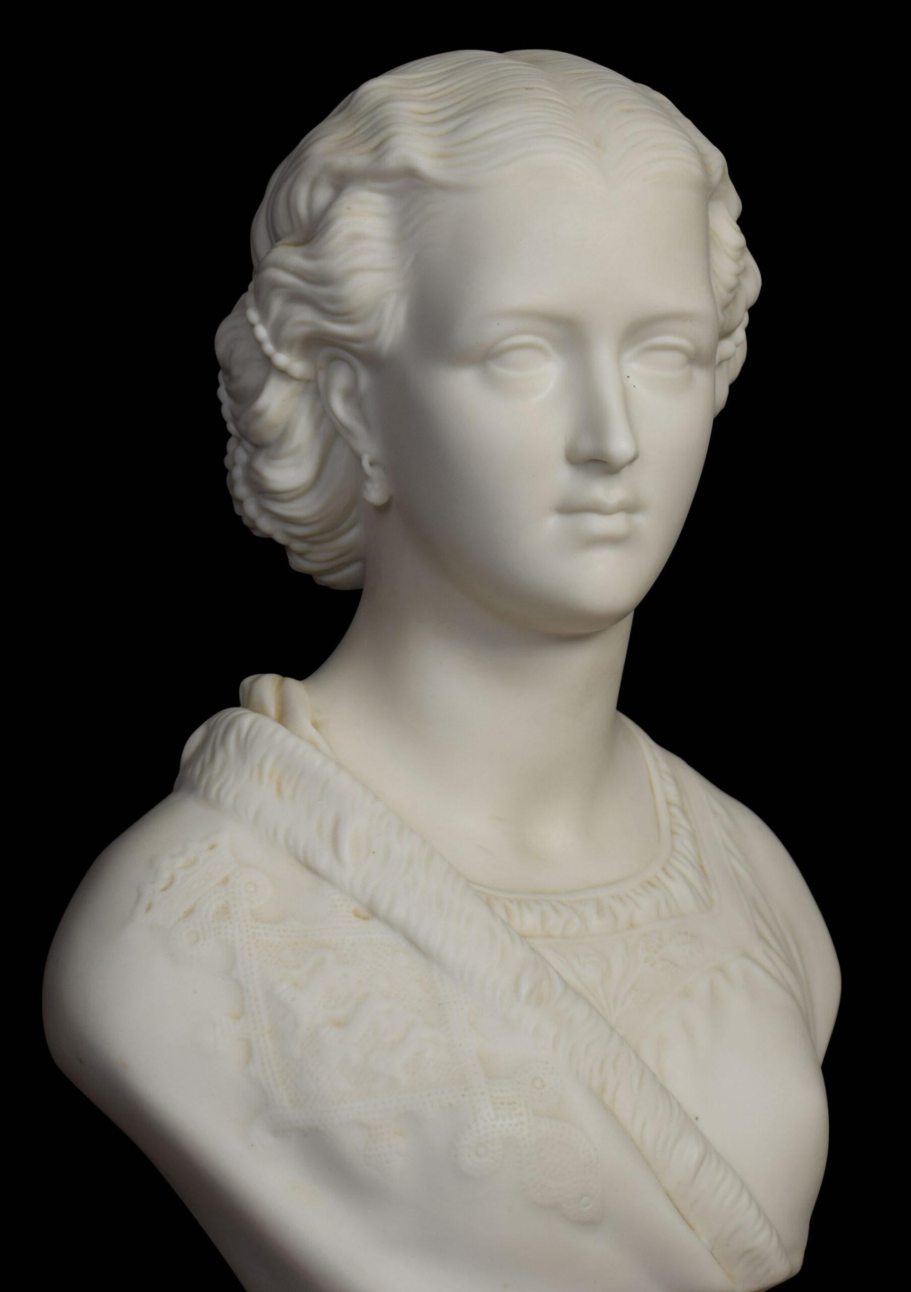 Copeland Parian bust of the Young Queen Victoria raised on a circular pedestal base.
Dimensions:
Height 12 inches
Width 7.5 inches
Depth 5 inches.
