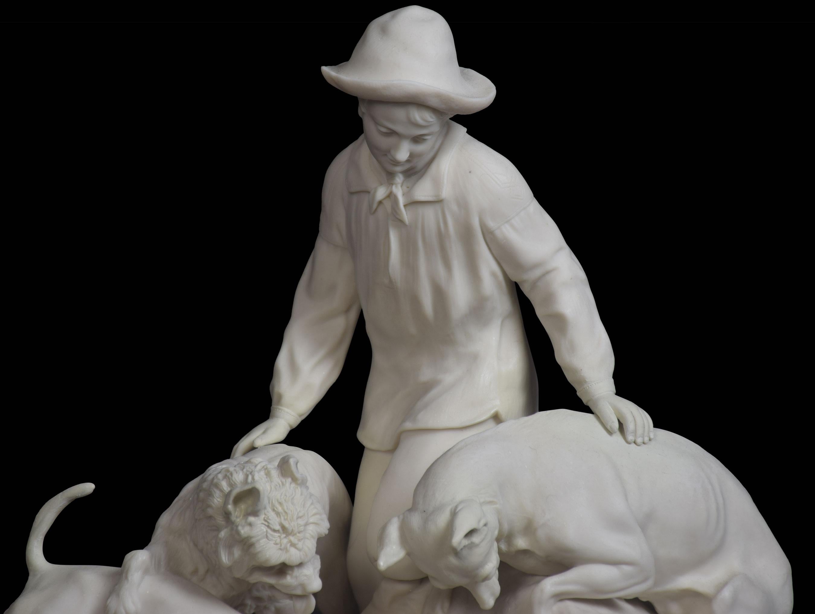 Parian group of a hunting scene depicting a man kneeling on a fallen tree with his dogs looking at a burrow.
Dimensions
Height 12.5 Inches
Width 13 Inches
Depth 6.5 Inches