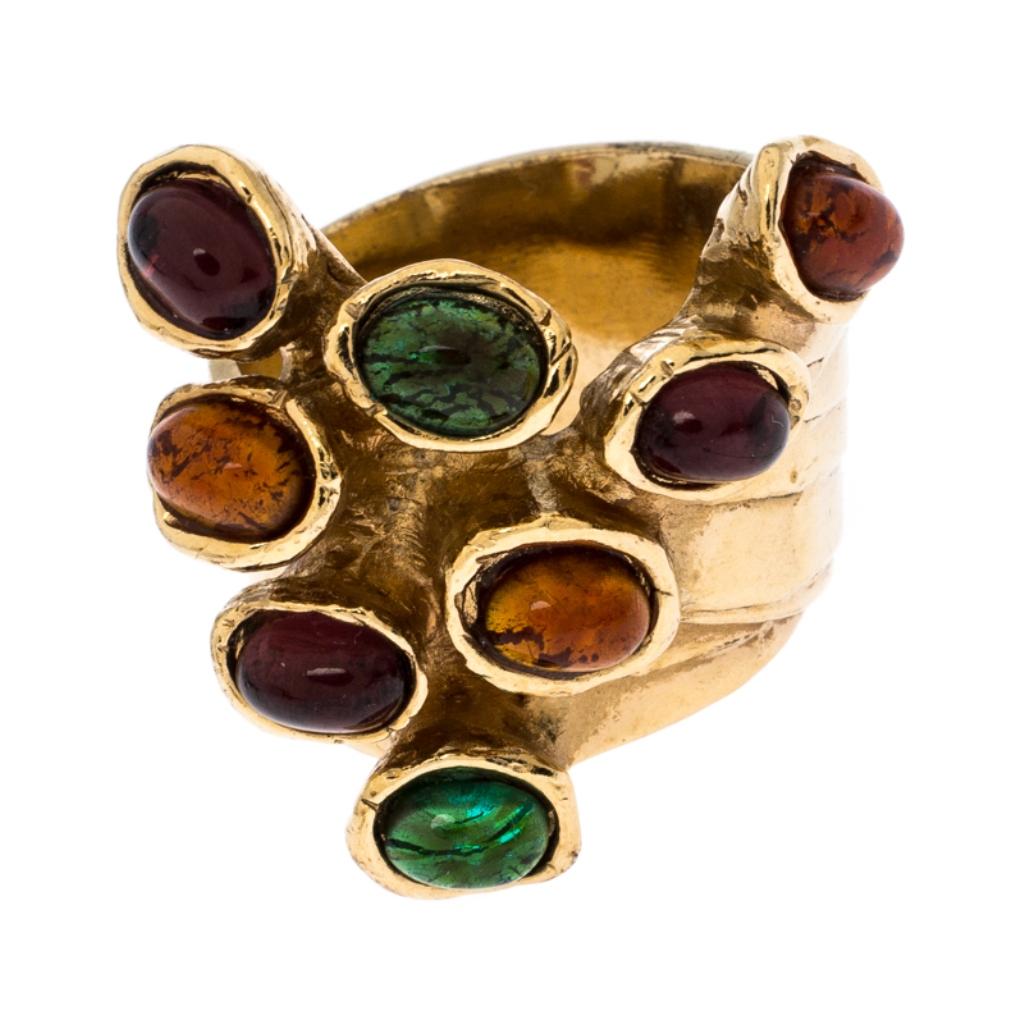 This Saint Laurent creation makes a loud statement with its size and catchy design. It has been crafted from gold-tone metal and detailed with multicolor cabochon. Also, the back of the ring carries the engravings of the brand.

Includes: Original