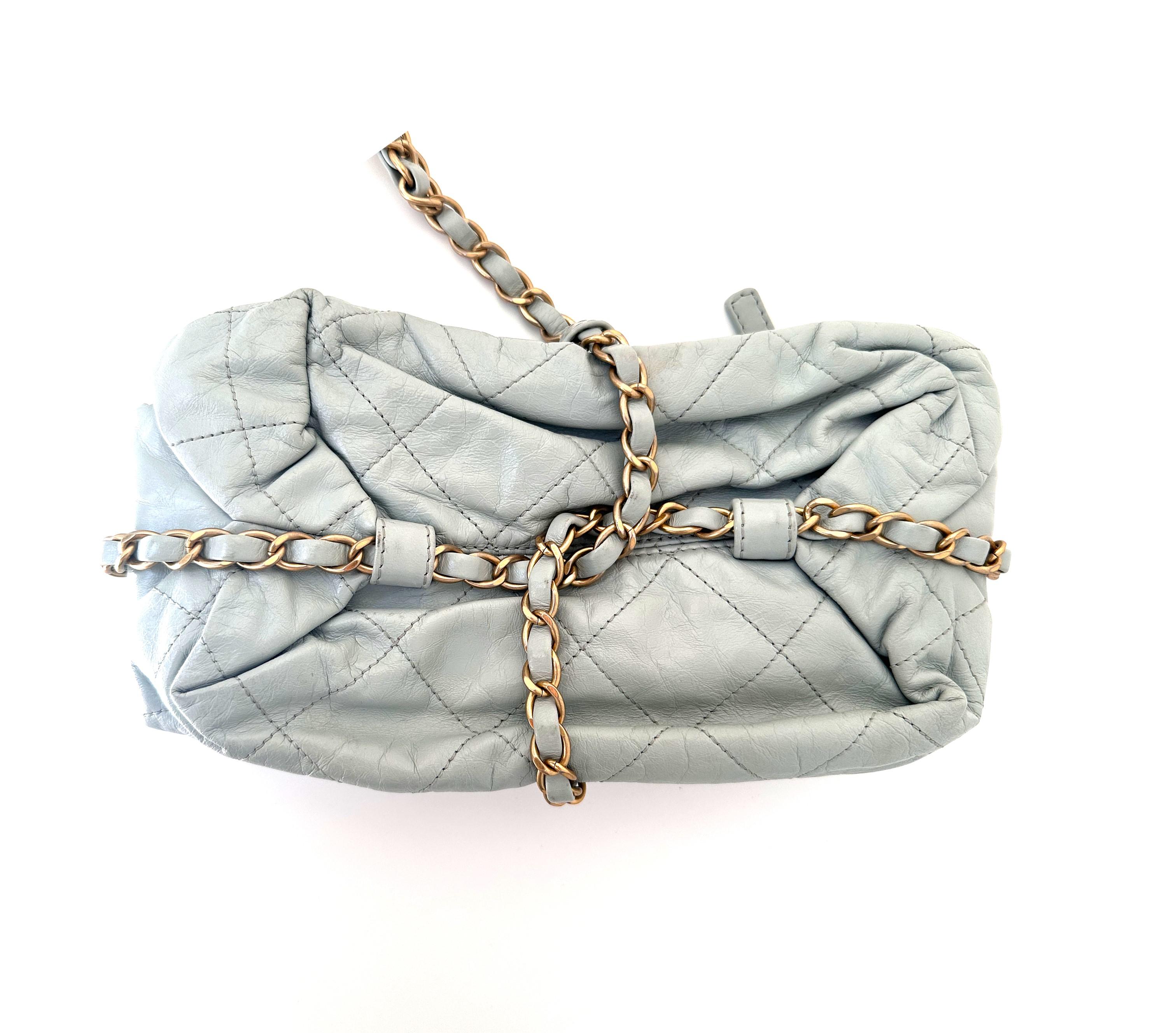 Part of CHANEL's 2011-2012 Paris-Bombay collection, this Parcel bag is crafted from smooth leather with a caged design. Its diamond-quilted construction is beautifully complemented by the leather and chain-link trim and the maison's signature