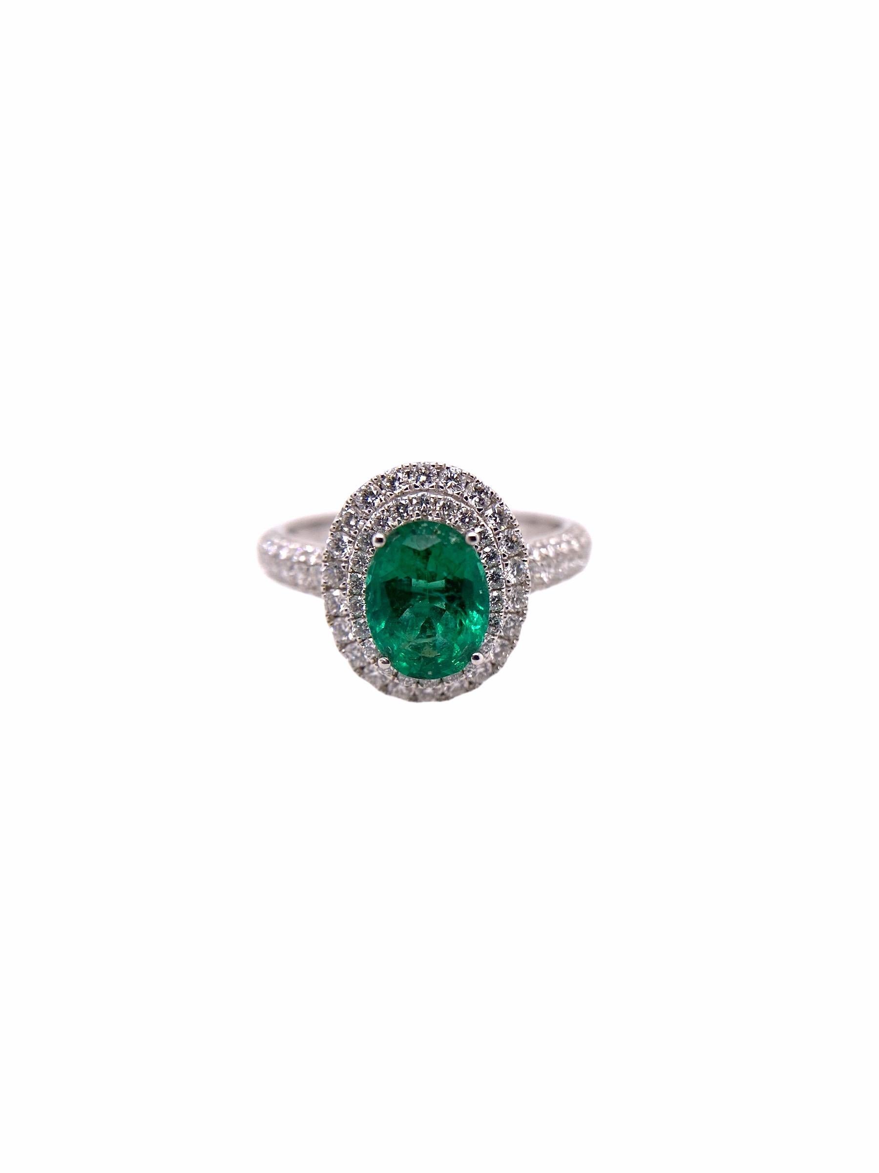 PARIS Craft House one-of-one Emerald Diamond Ring. Taking charge of the center stone is a 1.10ct Emerald in Oval-cut. Surrounding the ring are rounds of 86 Round Diamonds that weigh 0.66ct. Pave diamonds are also found around the band and they cover