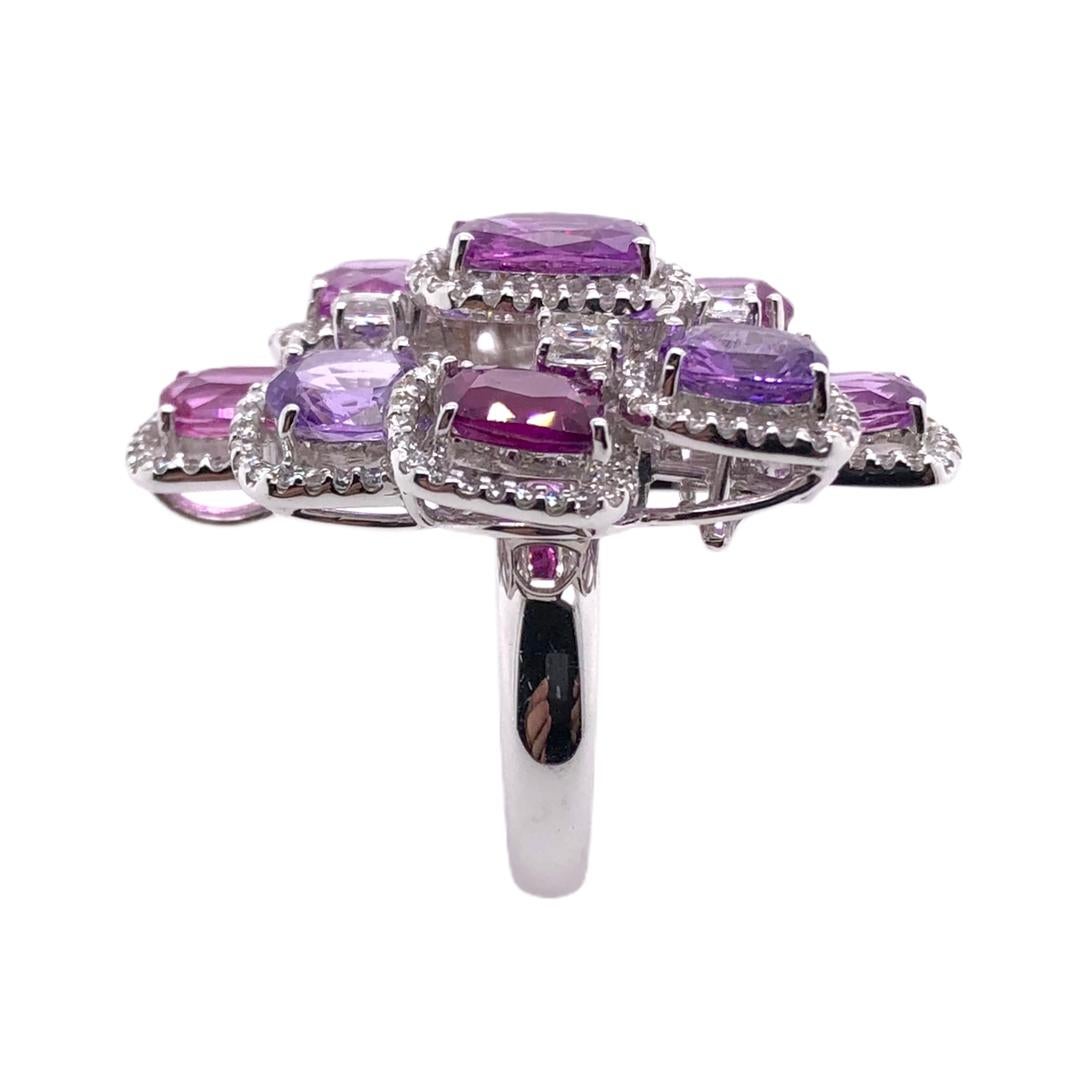 PARIS Craft House Multi Pink Sapphire Ring. Featured in this article is a combination of 9 lustrous Pink Sapphires of different shades in a elegant Cushion cuts, they weigh a sum of 11.20ct. Its center piece is accompanied with 4 Brilliant Diamonds