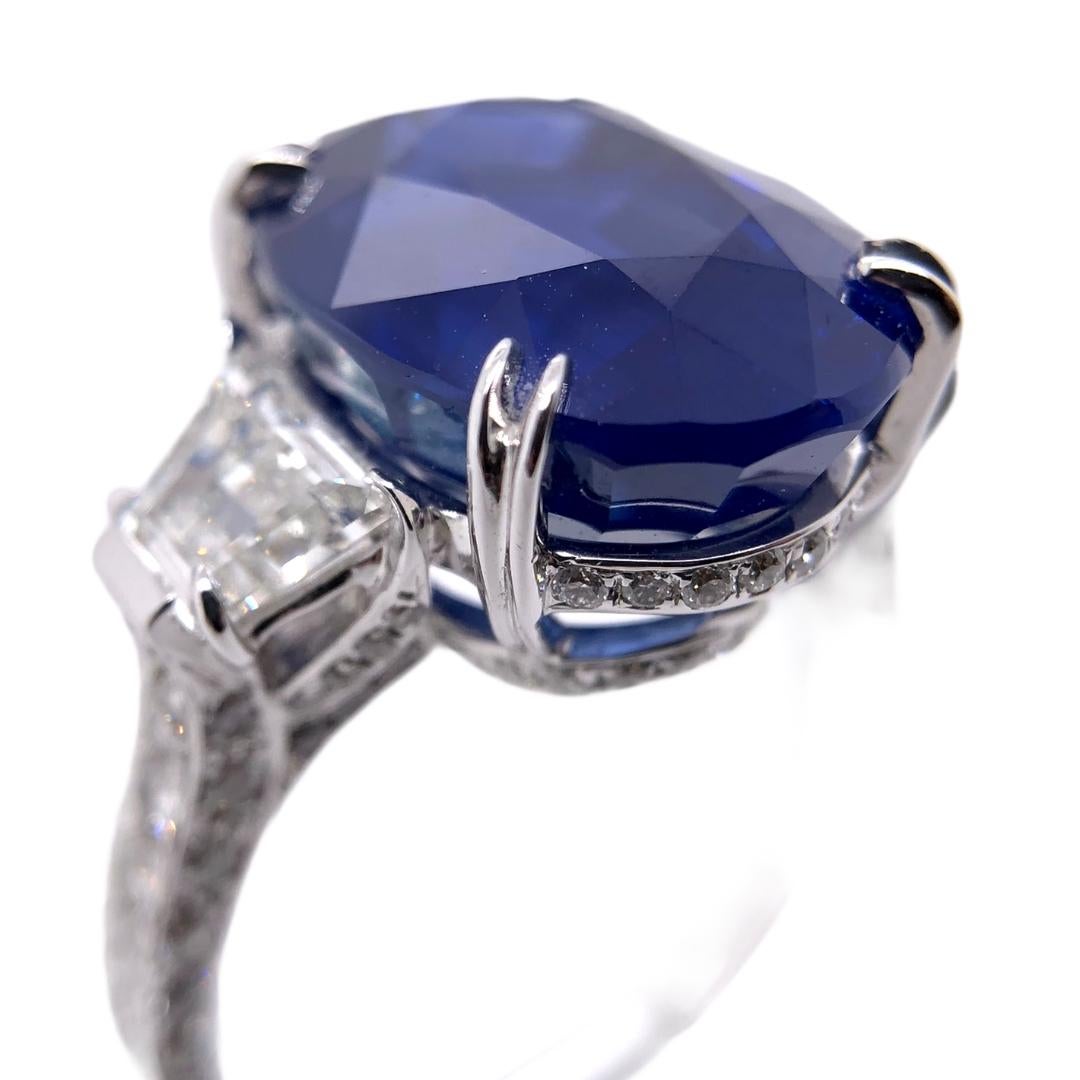 PARIS Craft House 11.30ct GRS Certified Cornflower Blue Sapphire Diamond Ring in 18 Karat White Gold.

- 1 GRS Certified Oval-cut Cornflower Blue Sapphire/11.30ct
- 2 Tappered Diamonds/1.13ct
- 101 Round Diamonds/0.68ct
- 18K White Gold/5.70g
- Ring