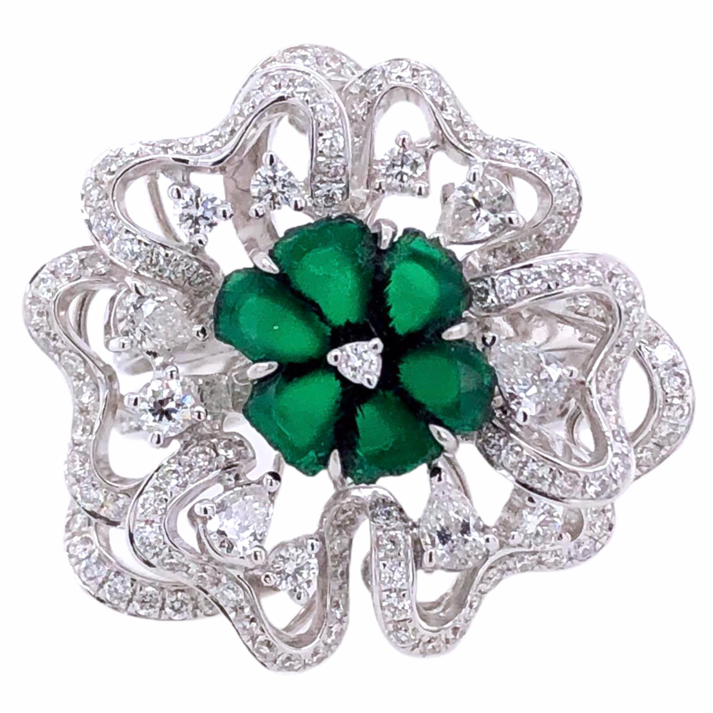 PARIS Craft House 1.87ct Rough-cut Emerald Diamond Flower Cocktail Ring in 18 Karat White Gold.

- 1 Rough-cut Emerald/1.87ct
- 5 Pear-cut Diamonds/0.32ct
- 159 Round Diamonds/0.97ct
- 6 Round Diamonds/0.17ct
- 18K White Gold/11.29g
- Size of ring