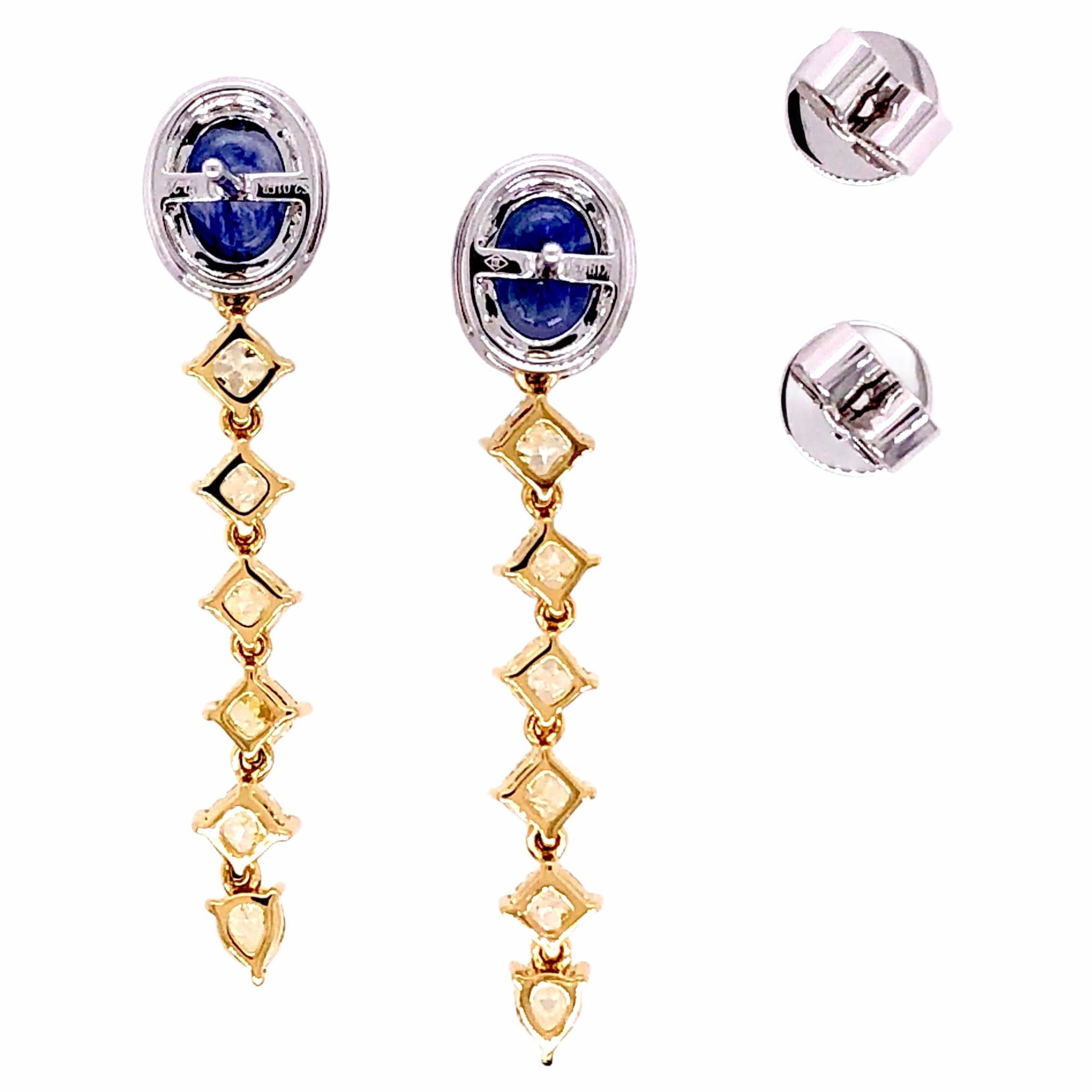 PARIS Craft House 2.01ct Blue Sapphire Yellow Diamond Earrings in 18 Karat White/Yellow Gold.

- 2 Oval-cut Blue Sapphires/2.01ct
- 12 Fancy-cut Yellow Diamonds/2.35ct
- 36 Round Diamonds/0.22ct
- 18K White/Yellow Gold

Designed and crafted at PARIS
