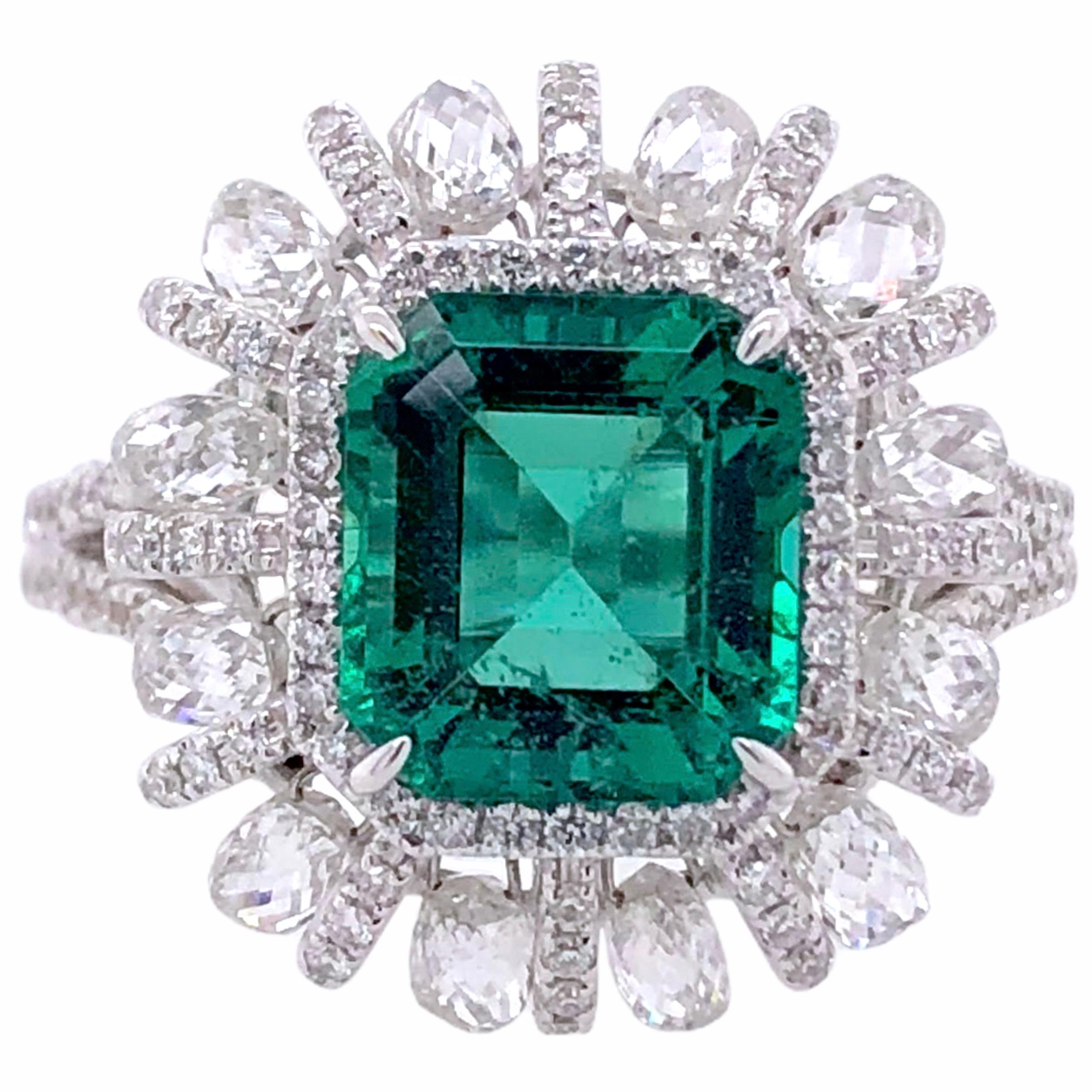 PARIS Craft House 2.98ct Emerald Diamond Ring in 18 Karat White Gold.

- 1 Cushion-cut Emerald/2.98ct
- 12 Briolette-cut Diamonds/1.60ct
- 252 Round Diamonds/0.82ct
- 18K White Gold/7.02ct
- Size of ring fitted to finger.

Designed and crafted at