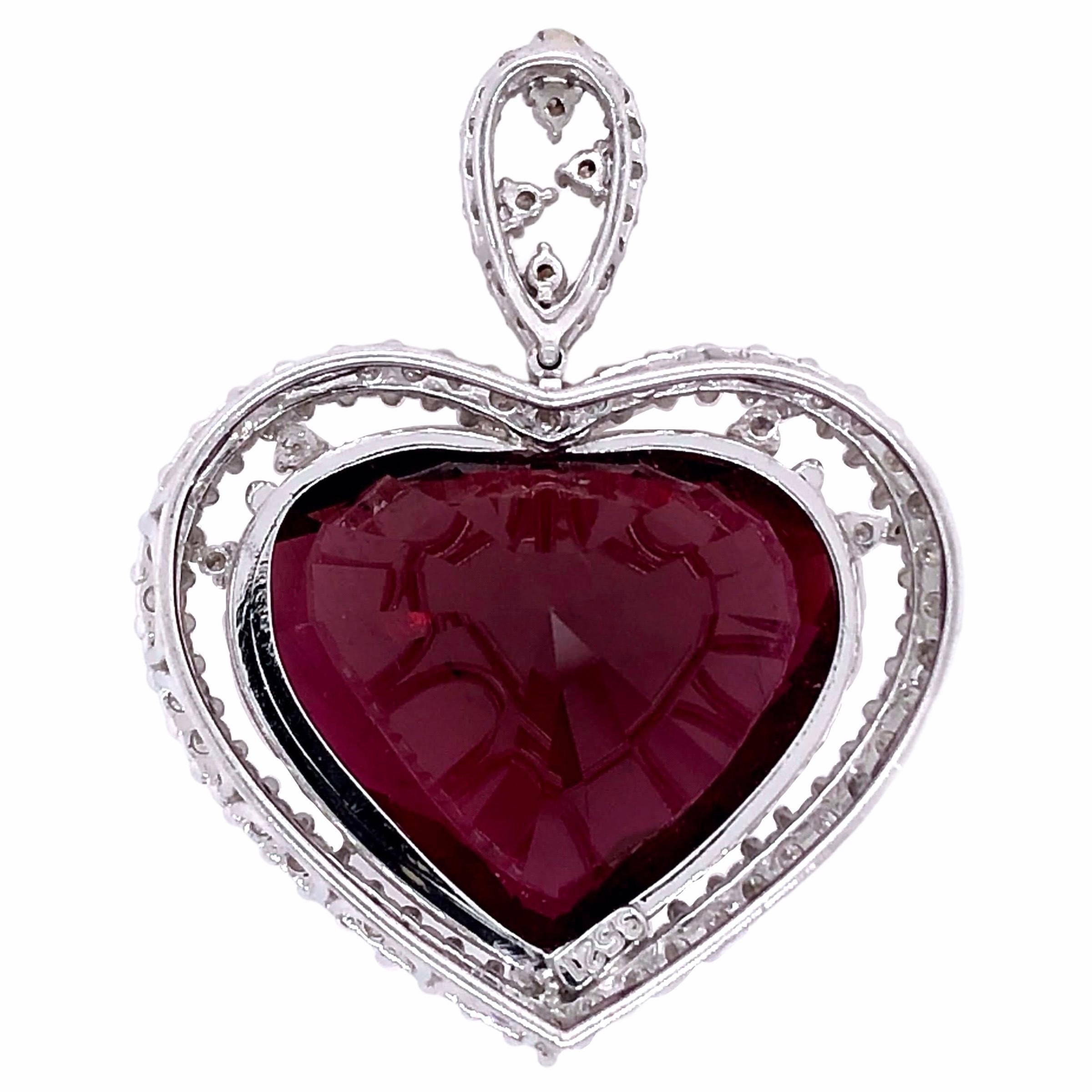 PARIS Craft House 35.21ct Rubellite Diamond Heart Pendant in 18 Karat White Gold.

- 1 Heart-cut Rubellite/35.21ct
- Pavé Diamonds
- 18K White Gold

Designed and crafted at PARIS Craft House.