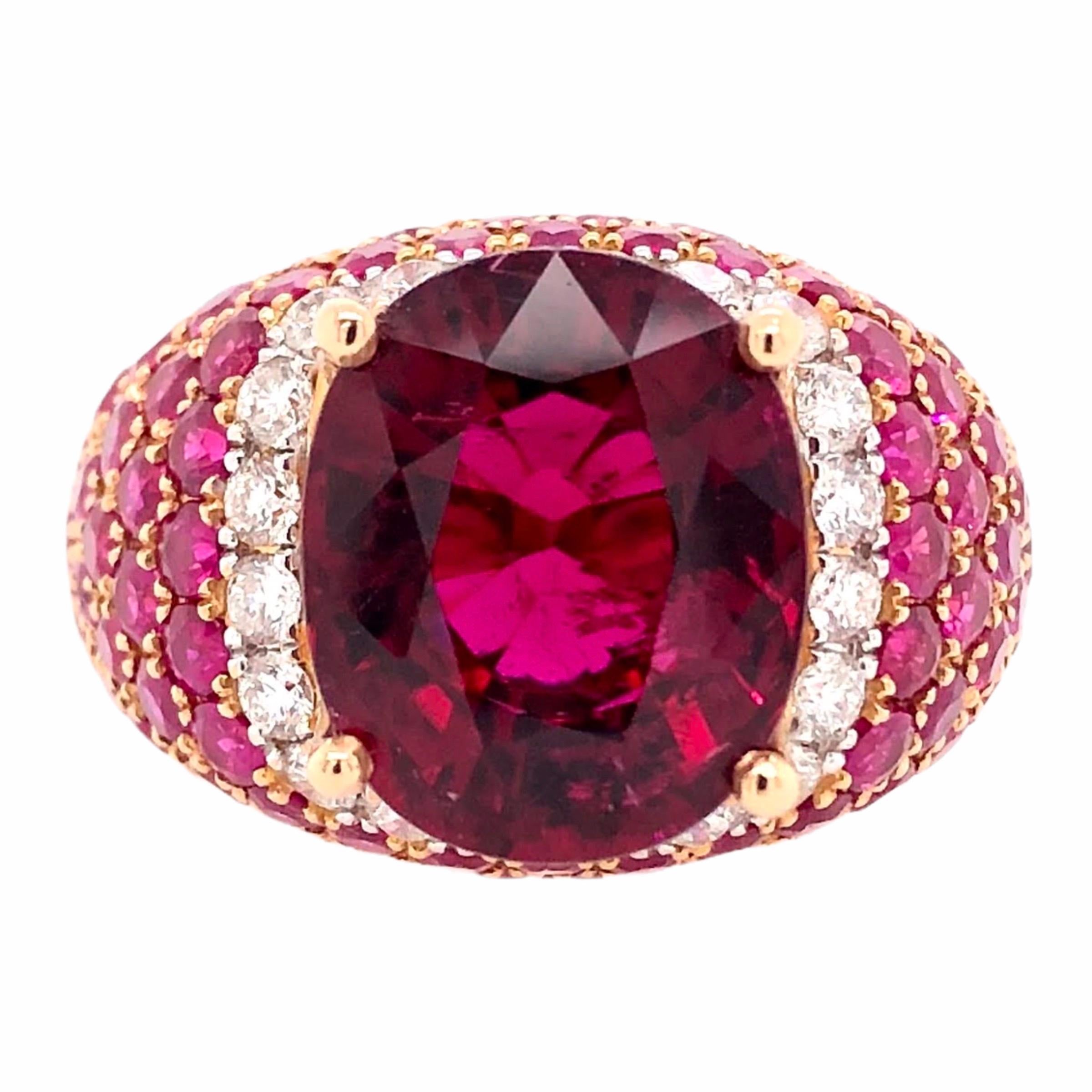 PARIS Craft House 6.21ct Rubellite Ruby Diamond Ring in 18 Karat Rose Gold.

- 1 Oval-cut Rubellite/6.21ct
- 92 Round Rubies/3.58ct
- 20 Round Diamonds/0.54ct
- 18K Rose Gold/8.24g

Designed and crafted at PARIS Craft House.