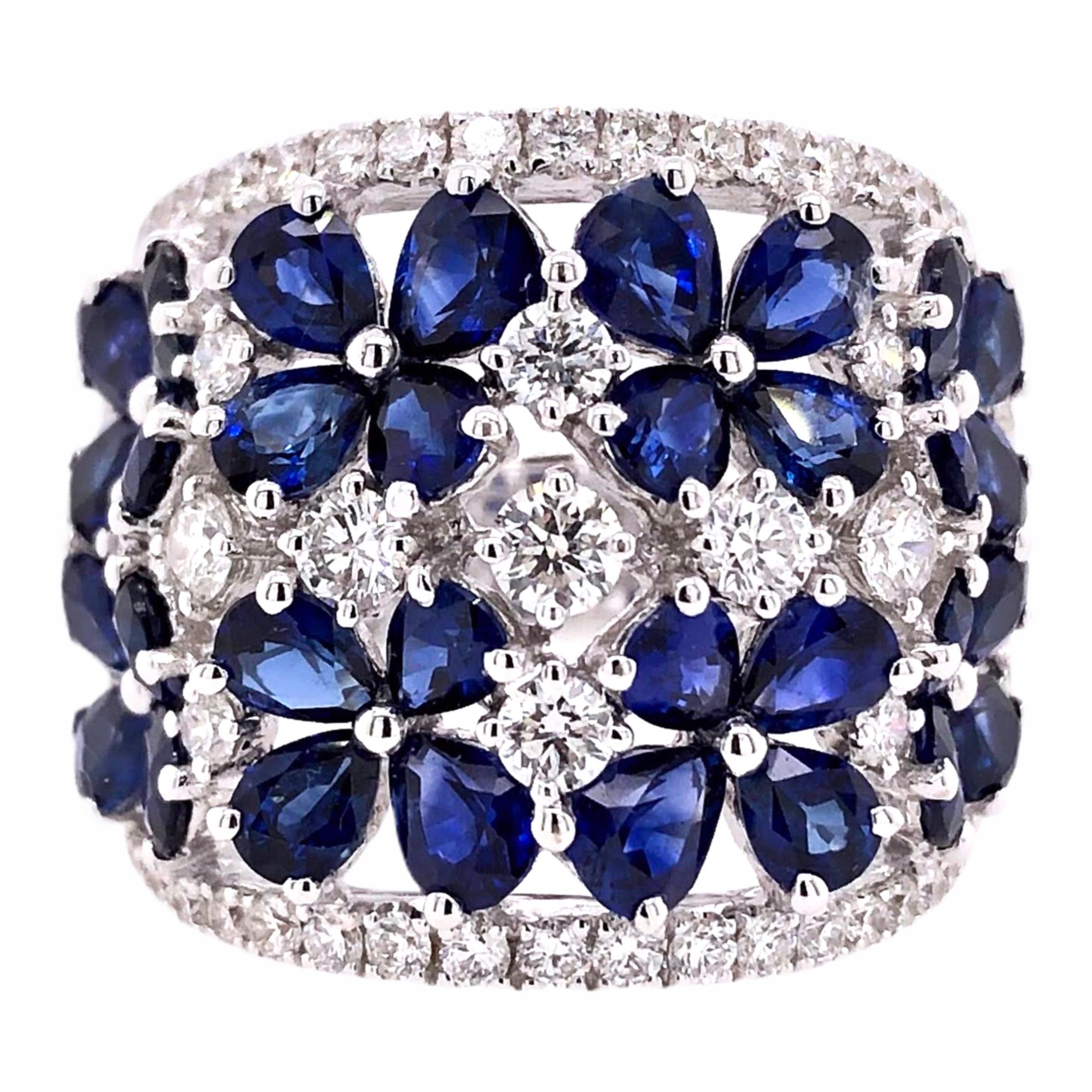 PARIS Craft House Sapphire Diamond Floral Ring in 18 Karat White Gold.

- 32 Pear-cut Sapphires/5.90ct
- 55 Round Diamonds/1.20ct
- 18K White Gold/10.02g

Designed and crafted at PARIS Craft House.