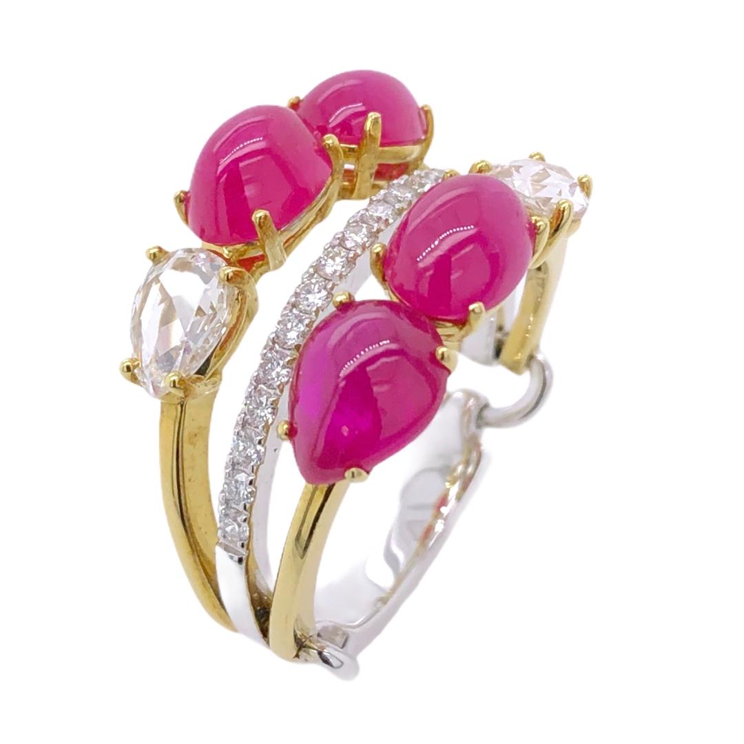 PARIS Craft House Cabochon Ruby Diamond Cluster Ring in 18 Karat White/Yellow Gold.

- 4 Cabochon Rubies/4.60ct
- 2 Pear-cut Diamonds/0.56ct
- Pavé Diamonds/0.20ct
- 18K White Gold/6.63g
- Ring size/US 6.5

Designed and crafted at PARIS Craft House.