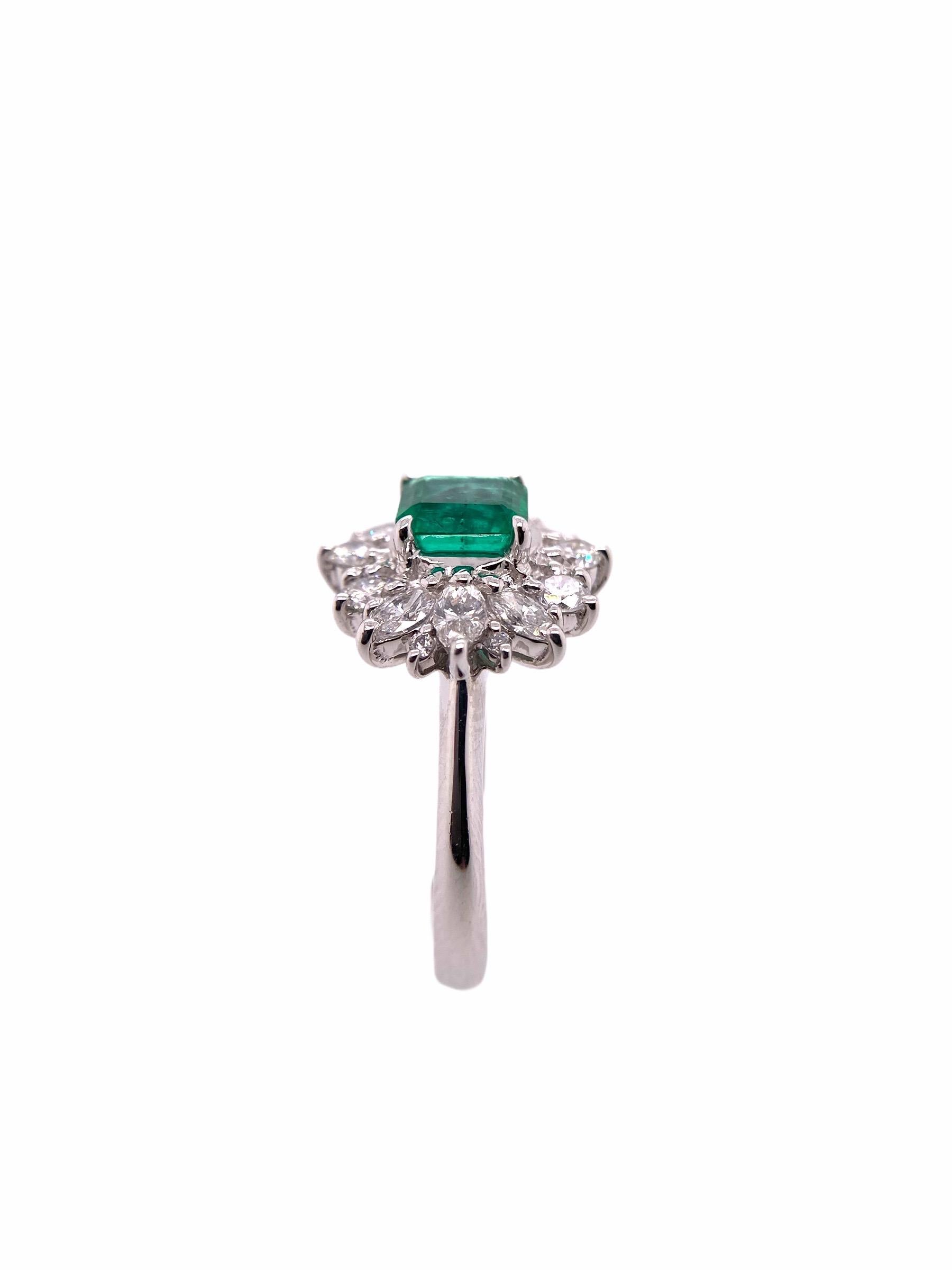PARIS Craft House one-of-one Emerald Diamond Ring. Crafted in Platinum showcasing local classic craftsmanship, the ring is crowned with an Oval-cut Emerald at the center of attraction. Matching Marquise-cut Diamonds were then hand selected before