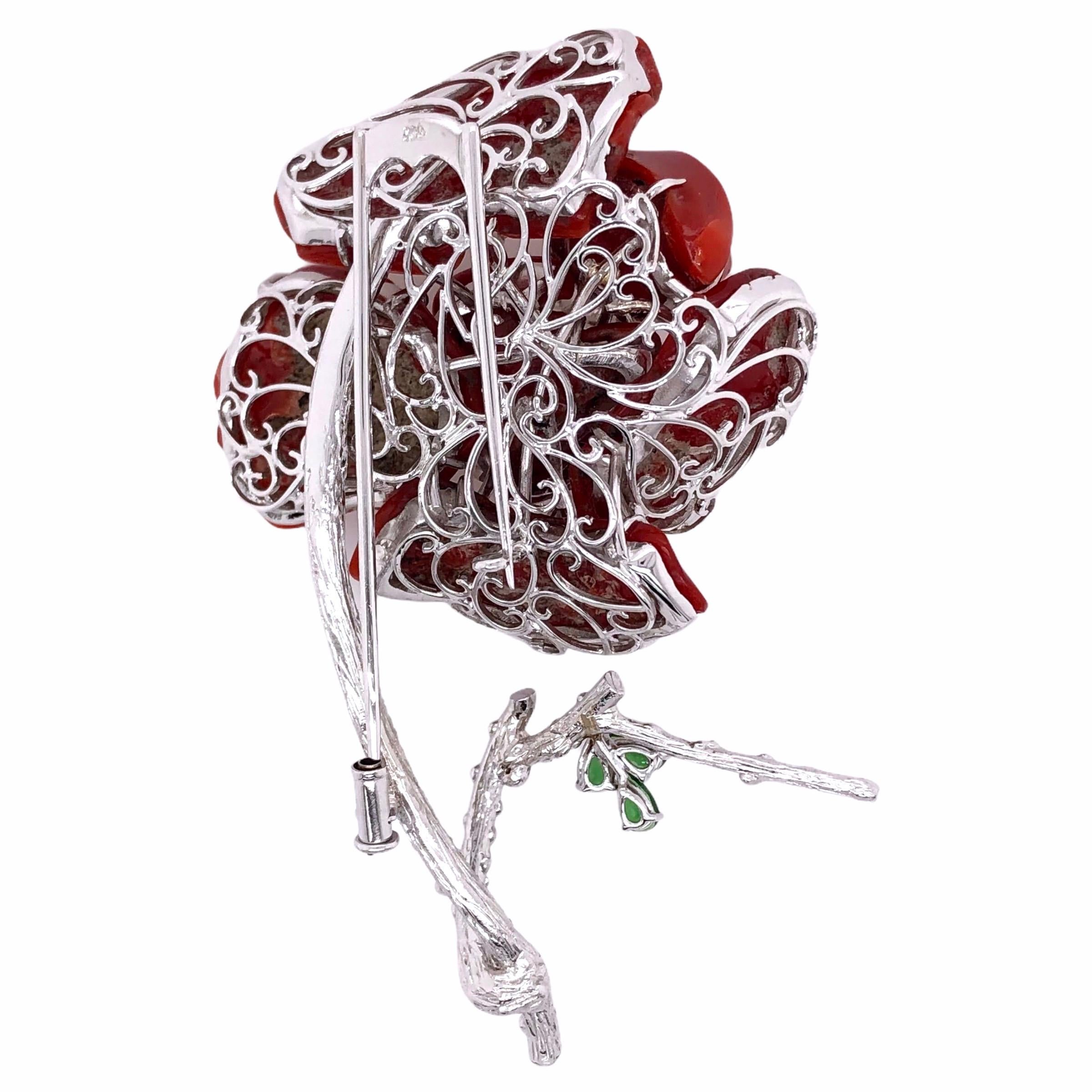 PARIS Craft House Coral Garnet Diamond Flower Brooch in 18 Karat White Gold.

- 6 Vivid Coral/9.04g
- 39 Round Diamonds/1.56ct
- 3 Green Garnets/0.60ct
- 18K White Gold/27.3g

Designed and crafted at PARIS Craft House.