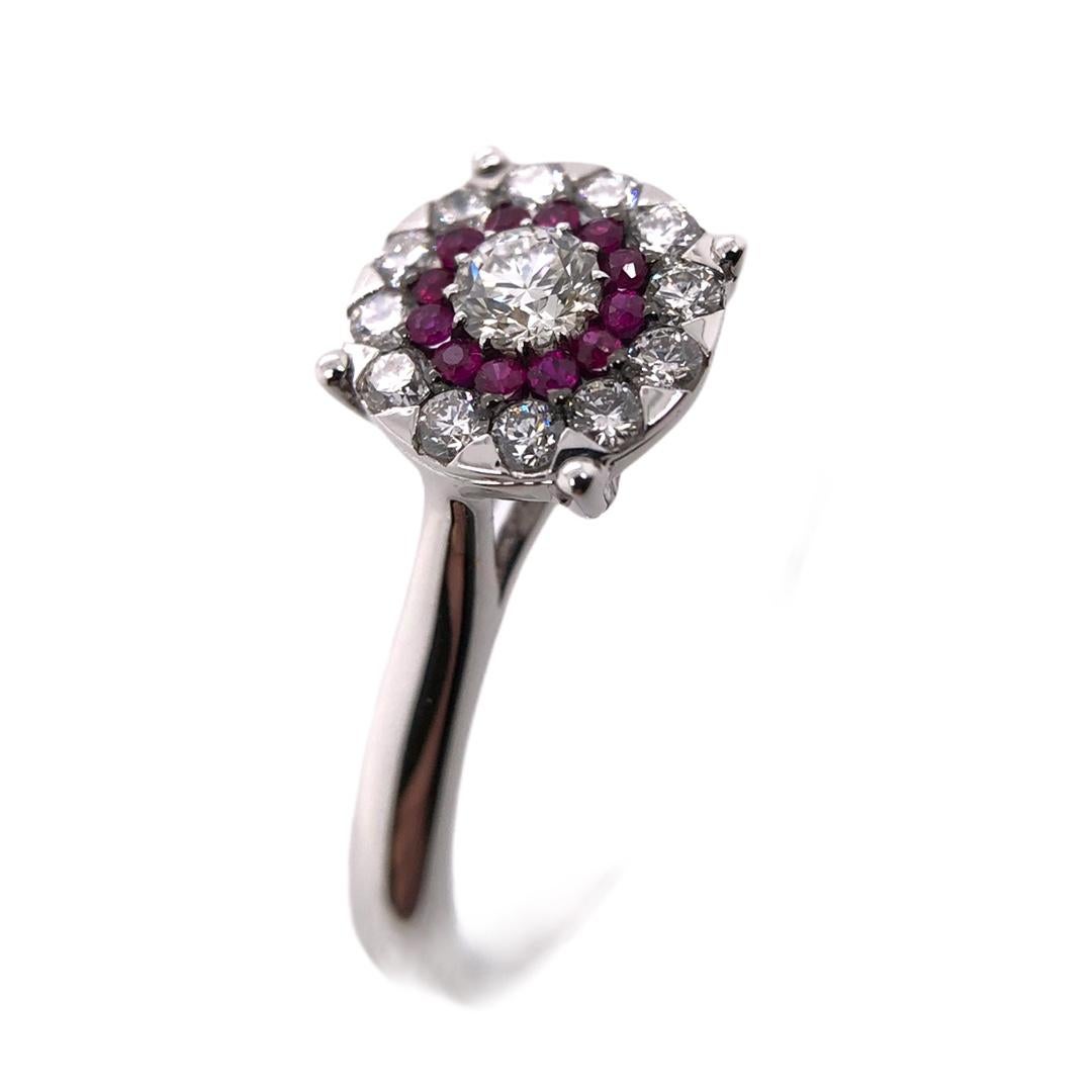 PARIS Craft House Ruby Diamond Ring. Featured in the article is this dreamy diamond ring crafted of 1 Round cut Diamond weighing 0.11ct, accompanied by 12 Round Diamonds and 12 Round Rubies, set exceptionally in cluster setting. A cluster setting is