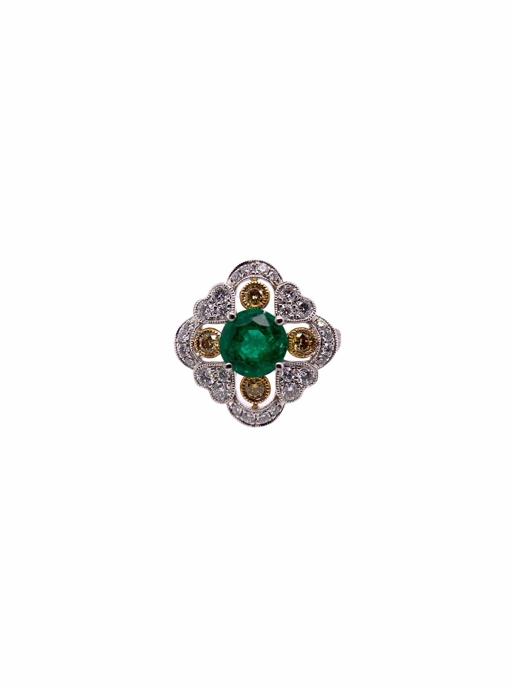 PARIS Craft House Deco inspired Emerald Yellow Diamond Ring. At the center of this ring sits a glowing 1.09ct Brilliant-cut Emerald. It is praised by 4 Yellow Diamonds weighing 0.21ct in total. Around them, they are cuddled by 60 White Round