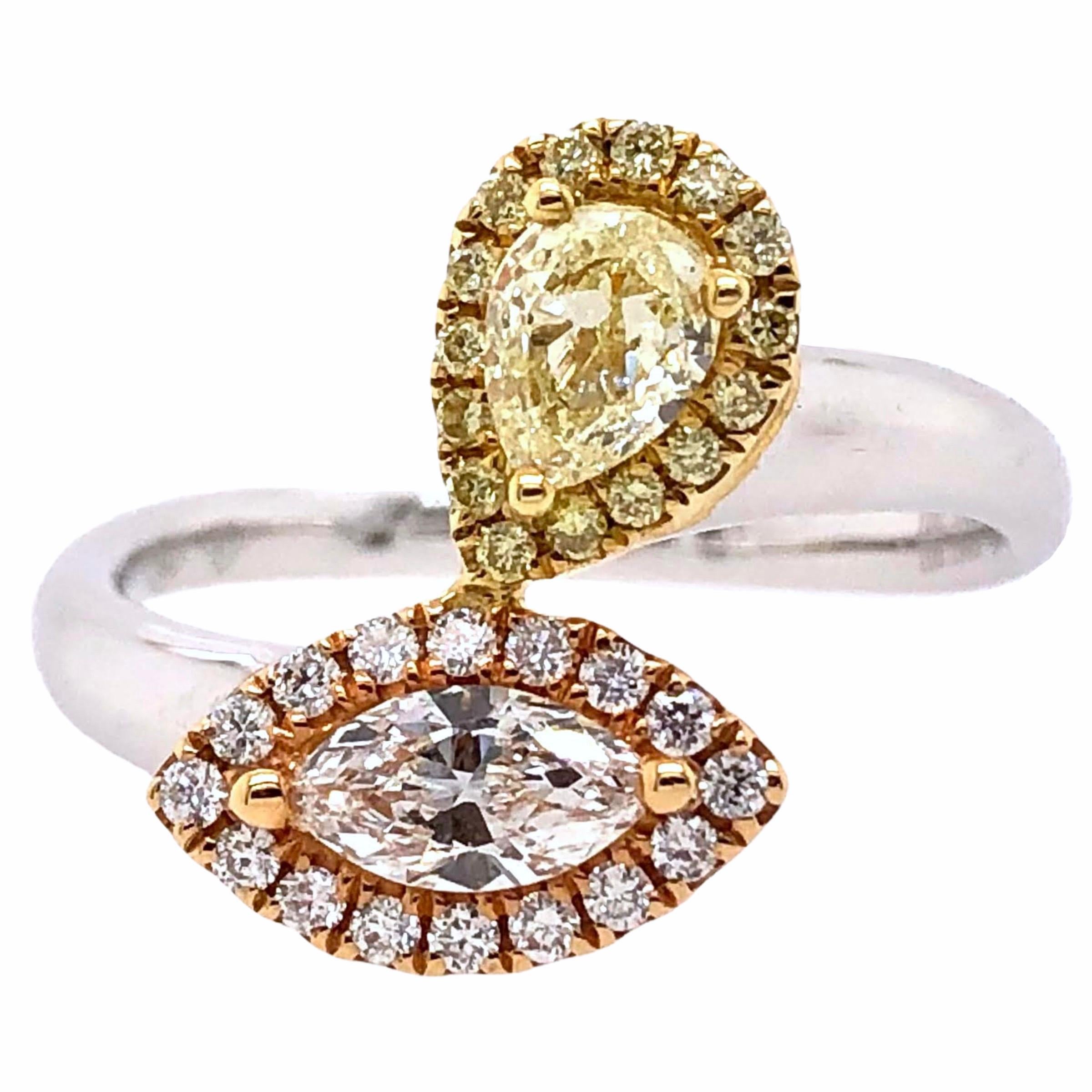 PARIS Craft House Fancy Diamond Ring in 18 Karat White/Yellow Gold.

- 1 Marquise-cut Fancy Yellow Diamond/0.35ct
- 1 Marquise-cut Diamond/0.29ct
- 31 Round Diamonds/0.21ct
- 18K White/Rose/Yellow Gold/3.43g

Designed and crafted at PARIS Craft