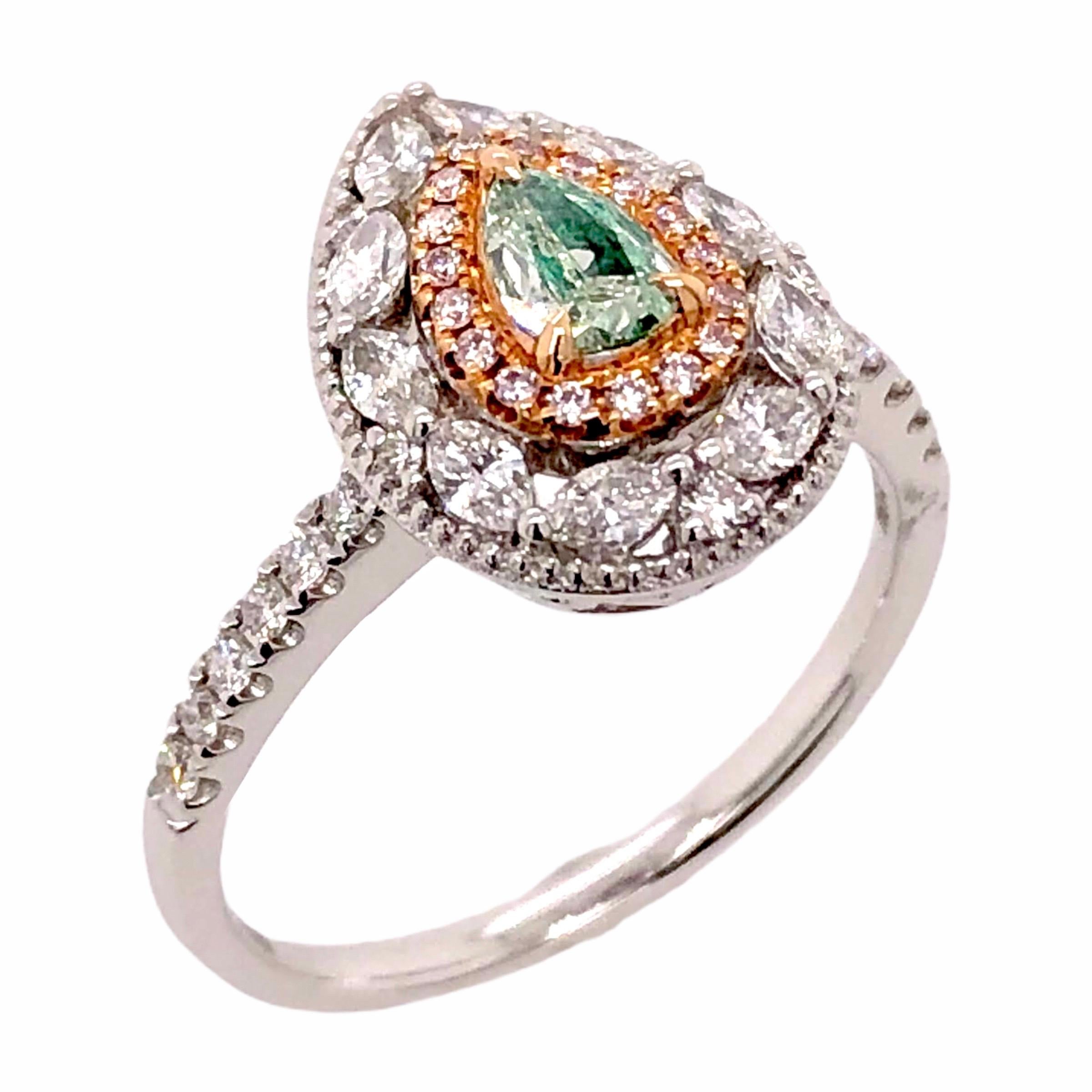 PARIS Craft House Fancy Green Diamond Ring in 18 Karat White Gold.

- 1 Pear-cut Green Diamond/0.20ct
- Mixed-cut Diamonds/0.53ct
- 18K White Gold/3.23g

Designed and crafted at PARIS Craft House.