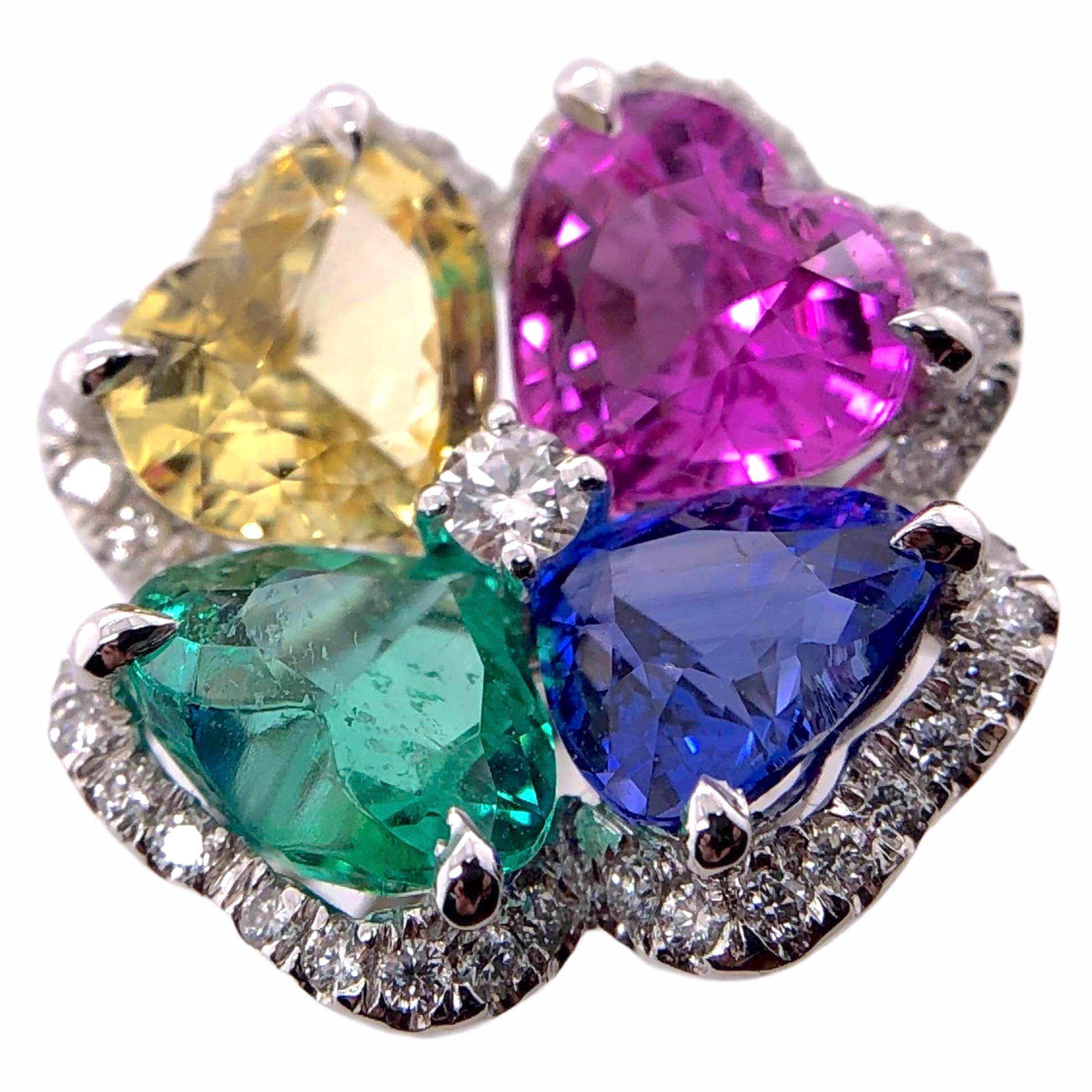 PARIS Craft House Multi Sapphire Emerald Heart Ring in 18 Karat White Gold.

- 1 Heart-cut Emerald/1.15ct
- 1 Heart-cut Pink Sapphire/1.88ct
- 1 Heatt-cut Blue Sapphire/1.41ct
- 1 Heart-cut Yellow Sapphire/1.65ct
- 1 Brilliant-cut Diamond
- Pavé