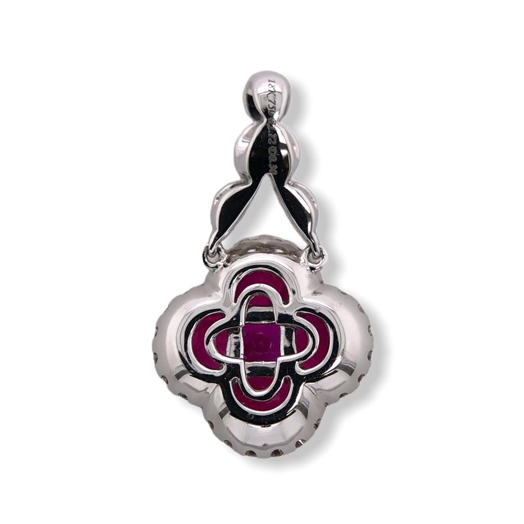 PARIS Craft House one-of-one Clover Ruby Diamond Pendant. This piece draws inspiration from the late 1800's from design to craftsmanship. Sitting as the center stone is a Princess-cut Ruby in invisible setting. To paint the silhouette of a lucky