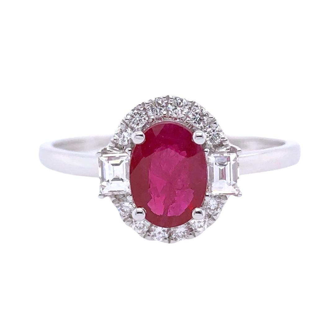 PARIS Craft House Ruby Diamond Cocktail Ring in 18 Karat White Gold.

- 1 Oval-cut Ruby/0.86ct
- 2 Baguette Diamonds/0.15ct
- 12 Round Diamonds/0.13ct
- 18K White Gold/1.67g
- Ring size/US 7

Designed and crafted at PARIS Craft House.