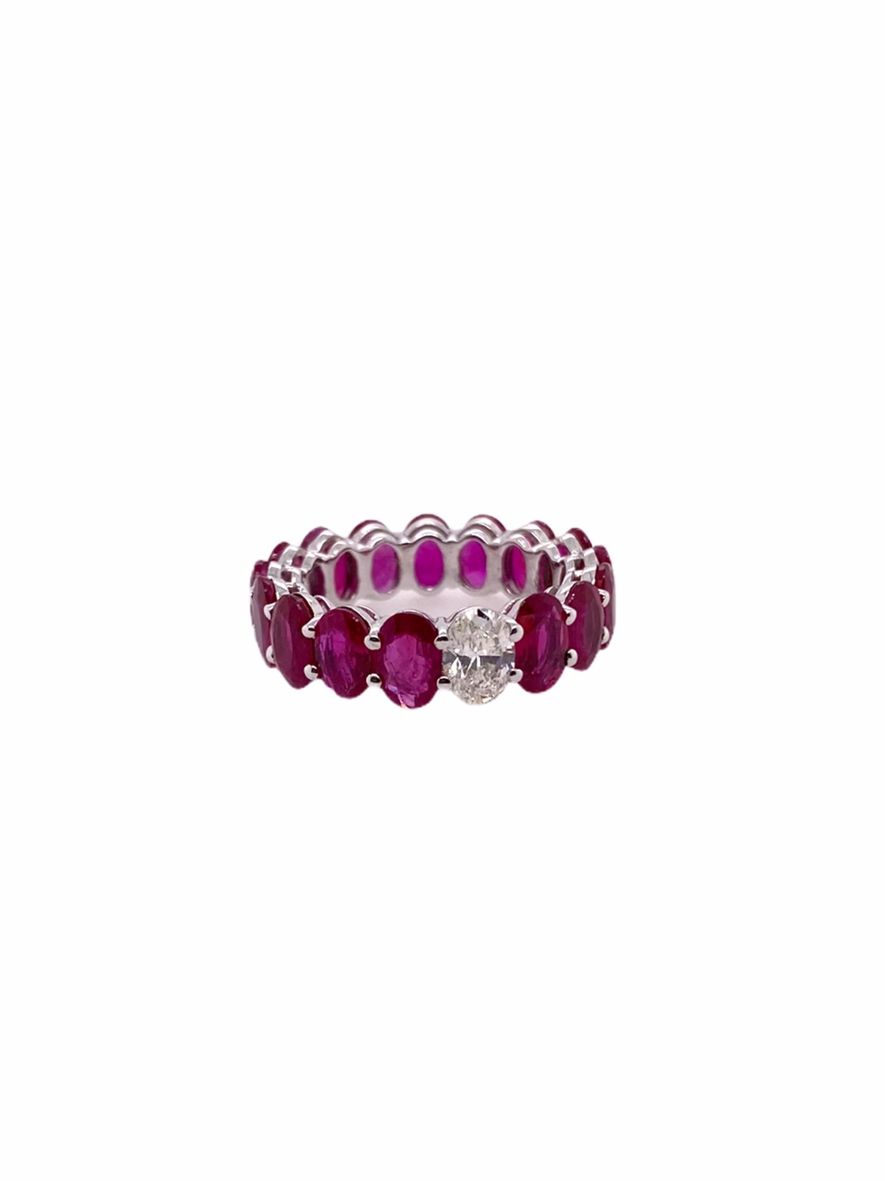 PARIS Craft House one-of-one Ruby Diamond Eternity Ring. Sitting tightly under the 18 Karat White Gold prongs are 16 lustrous Oval-cut Rubies in matching size, cuts and color weighing 8.20ct hand picked by the house. In contrast of their color, the