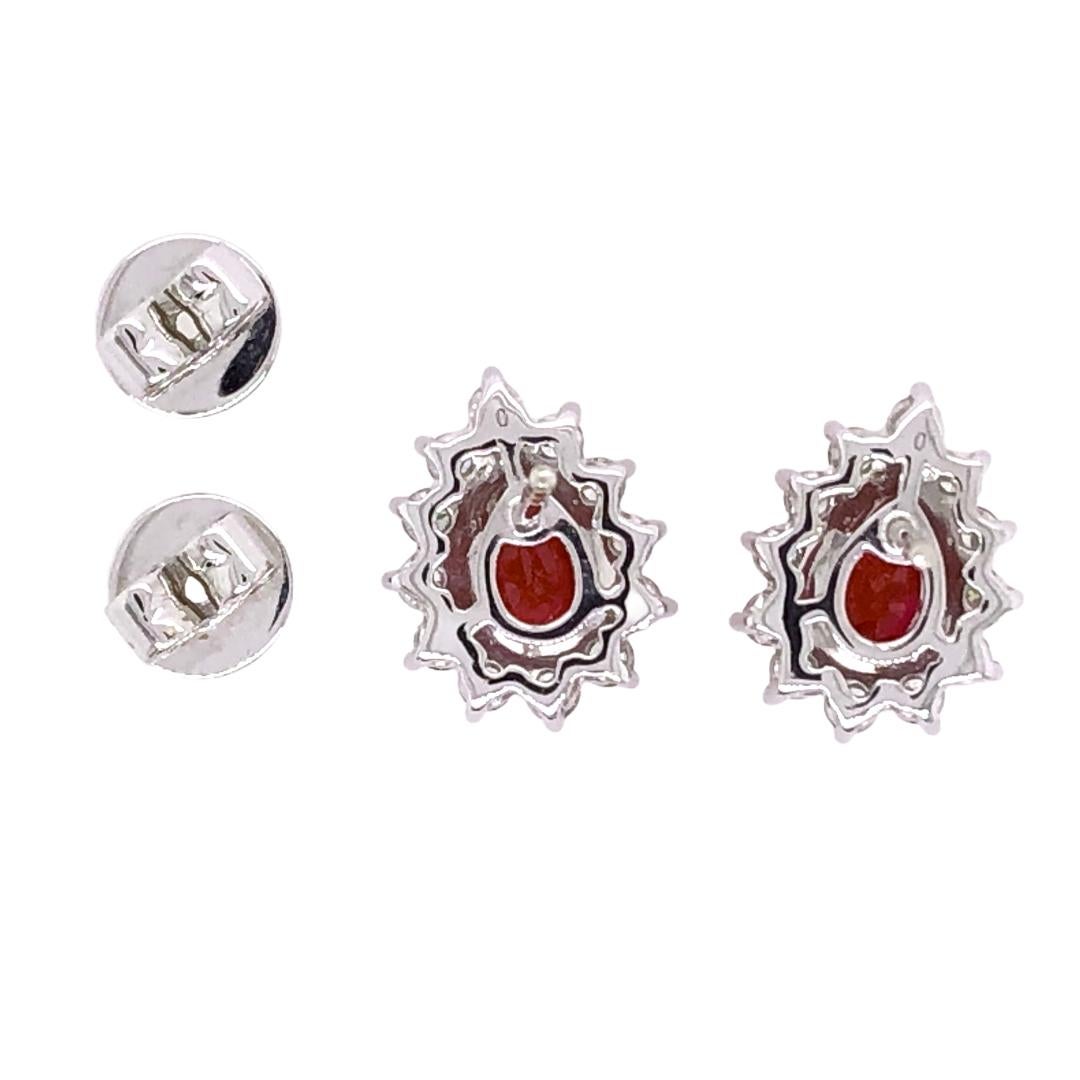 PARIS Craft House Ruby Diamond Stud Earrings in 18 Karat White Gold.

- 2 Pear-cut Rubies/1.62ct
- 24 Round Diamonds/0.69ct
- 18K White Gold/3.31g

Designed and crafted at PARIS Craft House.