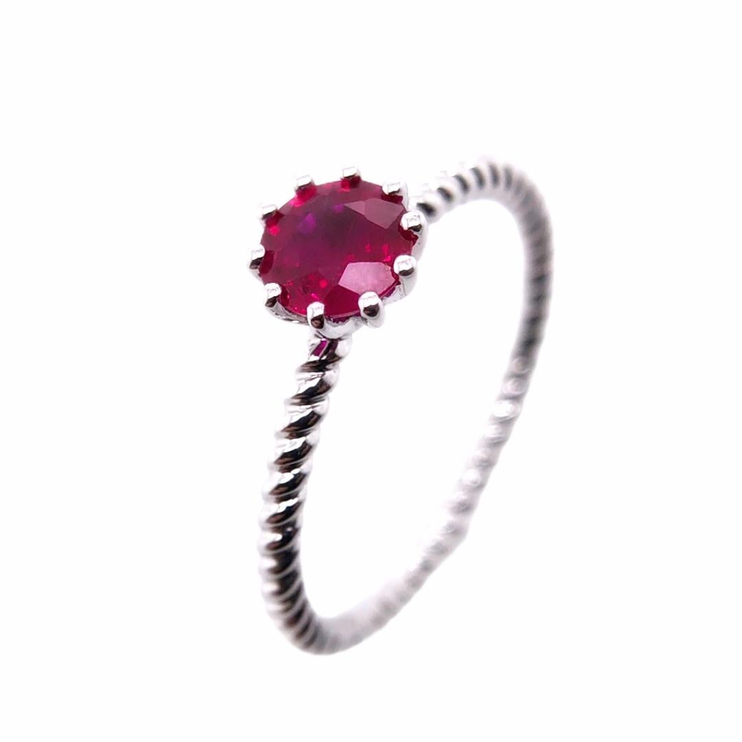 PARIS Craft House Princess Solitaire Ring. Featured on this ring is a Round-cut wine red Ruby of 0.65ct, sturdily set in a 8-prongs setting. Crafted in 18 Karat White Gold, its band garnered inspiration from jewelry house of the late 1800's. A
