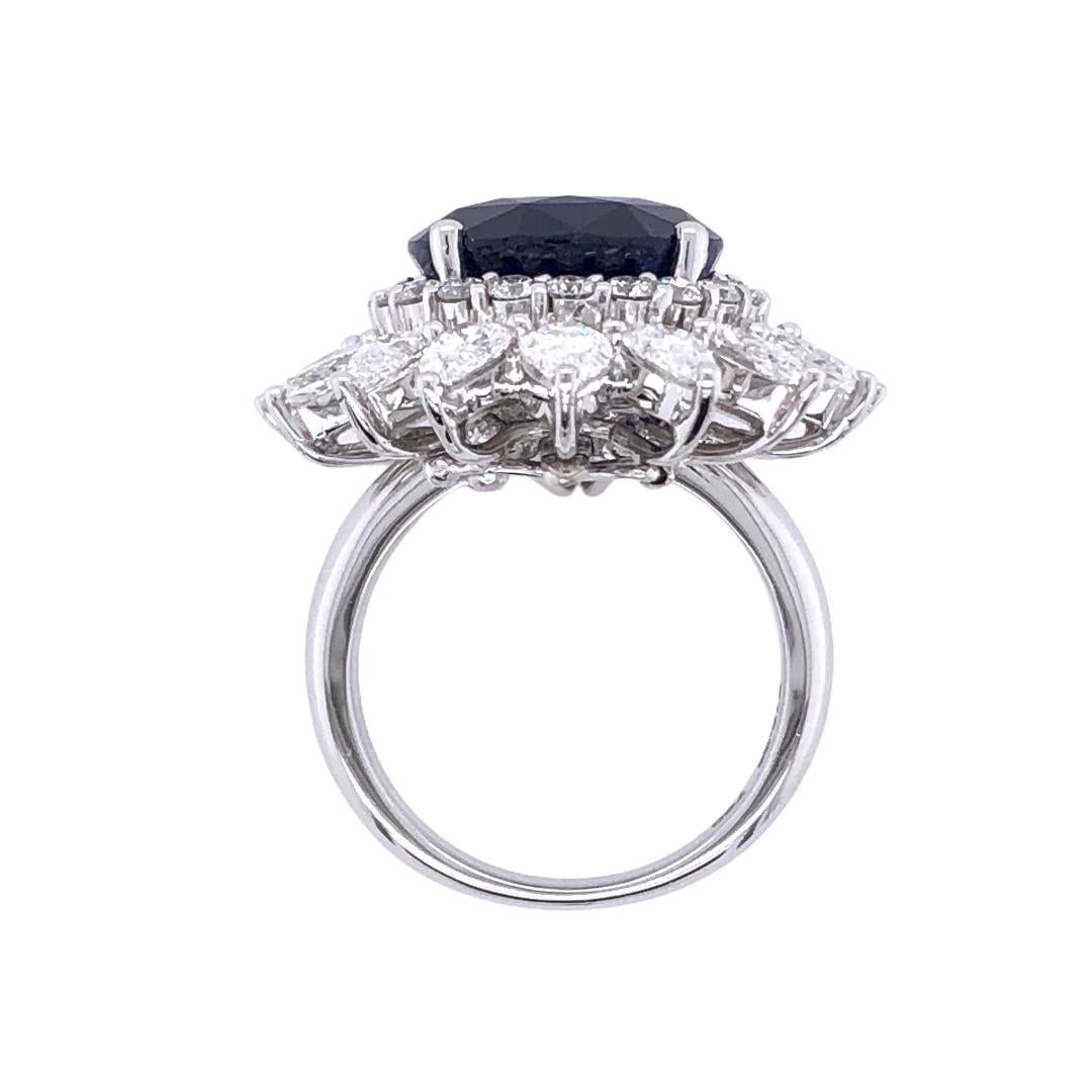 Sapphires are believed to symbolize wisdom, virtue, good fortune, and holiness for royals. On this 18K White Gold ring, a 12.36ct Oval Cut Blue Sapphire was hand selected by senior maison to be attached at the craft house. The ring is adorned with a