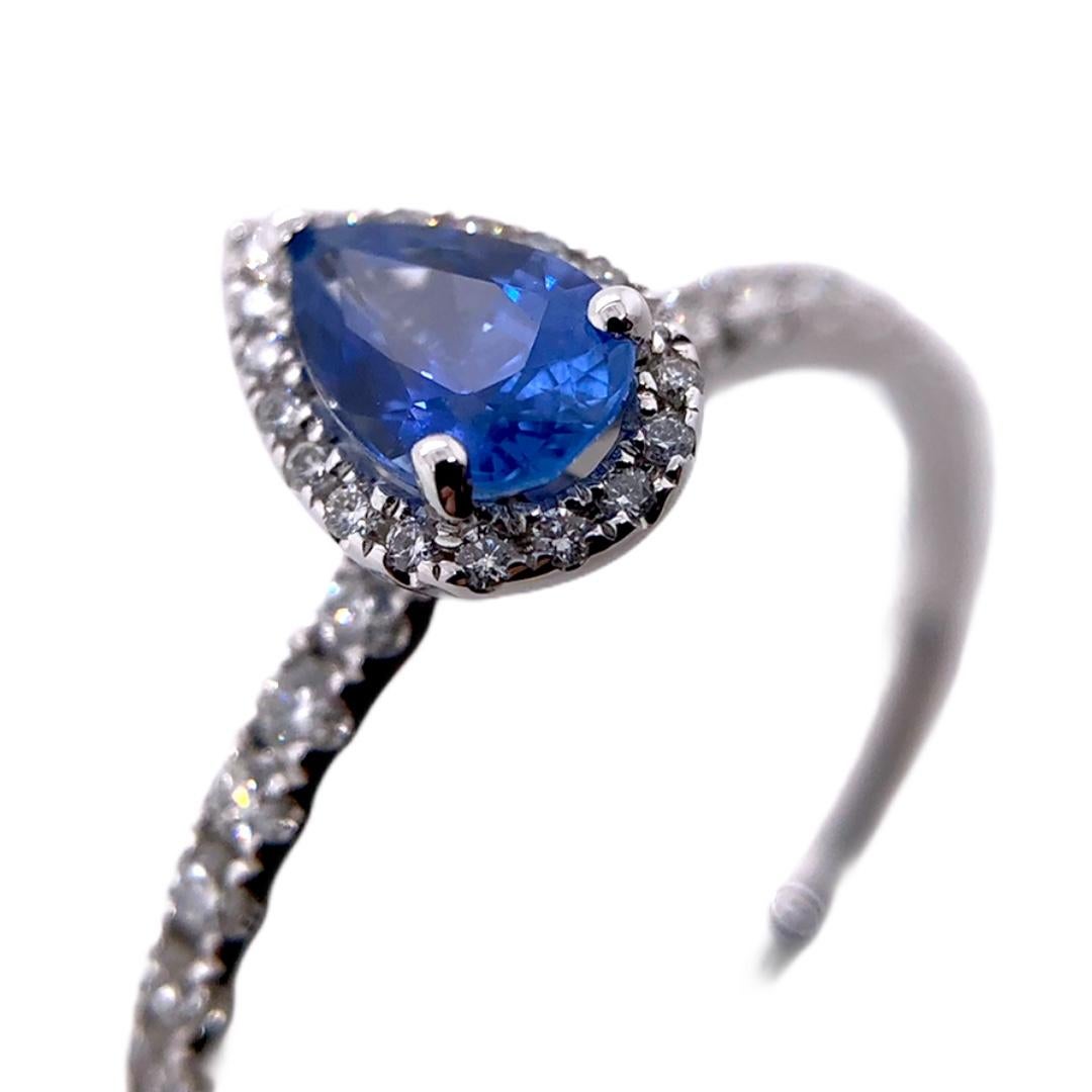 PARIS Craft House Sapphire Princess Ring. This article features a deep crystal blue Sapphire in Pear-cut with a weight of 0.52ct. Crafted in 18 Karat White Gold, the stone is appraised with showers of Round Diamonds stemming down the band.

- 1