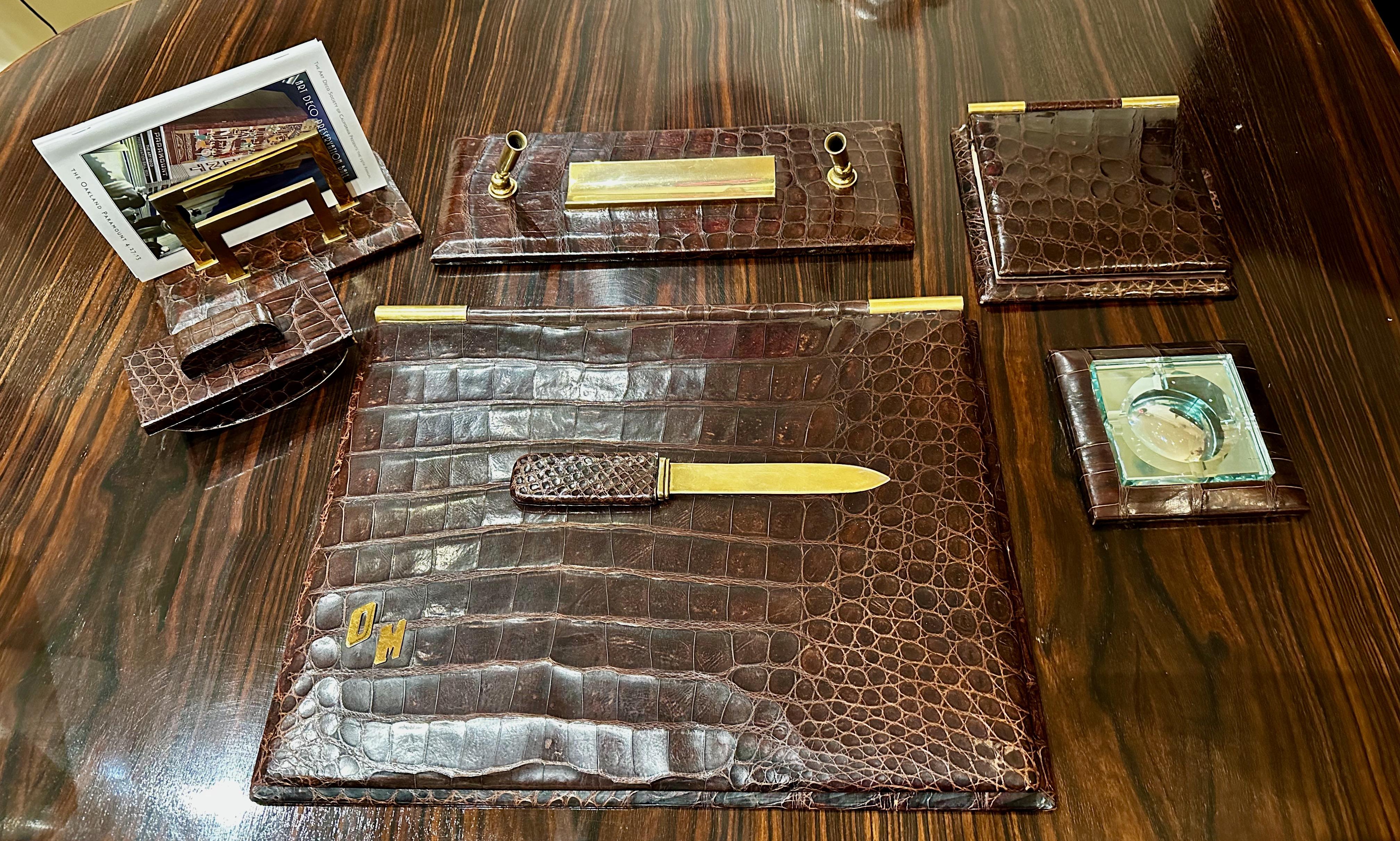 French Art Deco 7-piece crocodile skin desk set in the style of the Paris company Hermes, very fine 7- piece desk set in rich deep brown crocodile skin. May have been designed by Paul Dupré-Lafon who worked for Hermes and is best known for these