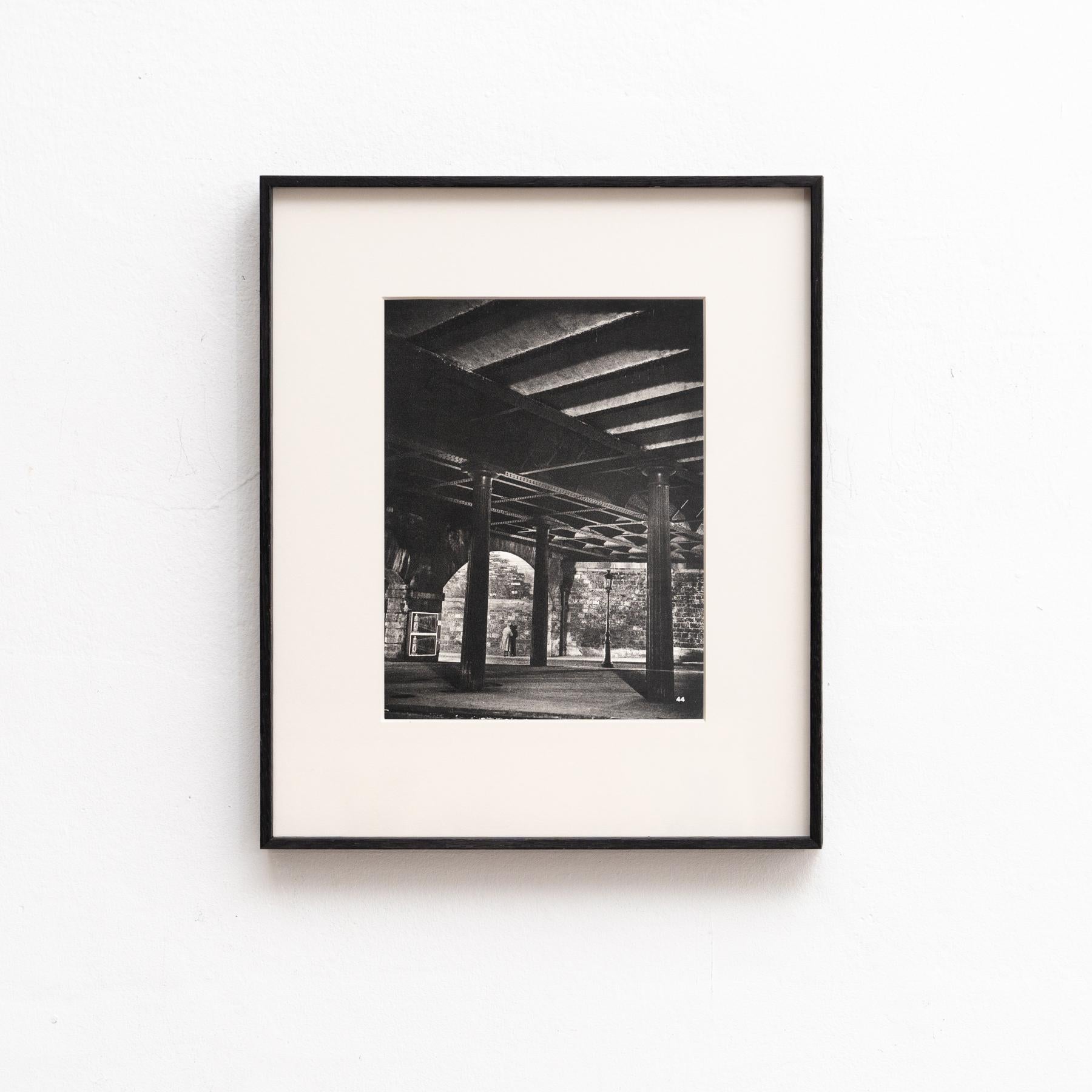 Capture the essence of 1930s Paris with this rare framed heliogravure photography by Brassai, showcasing mesmerizing scenes from his iconic book 