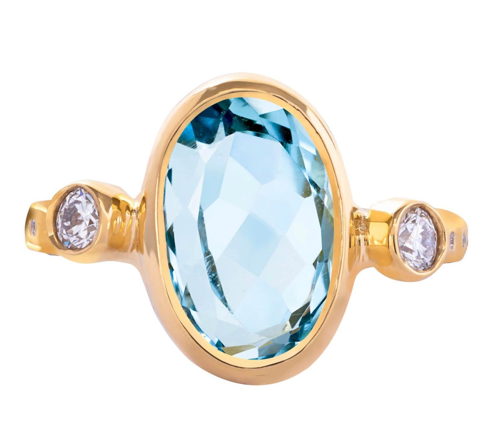 From the Tale of Five Rings Collection, this 22K gold ring has a stunning 4.11 carat aquamarine center stone, .3mm brilliant cut side diamonds, and .8mm diamonds surrounding top and sides of the ring band. This ring is completely hand crafted and