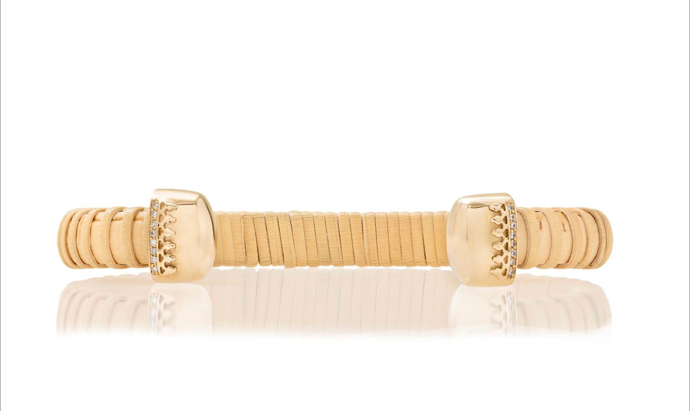 Nantucket Basket Lightship jewelry is a tradition in New England. This handmade cuff celebrates the tradition with a modern esthetic by adding gold and diamonds. Thin natural cain & rattan cuff with 10K yellow gold caps and 14K yellow gold filigree