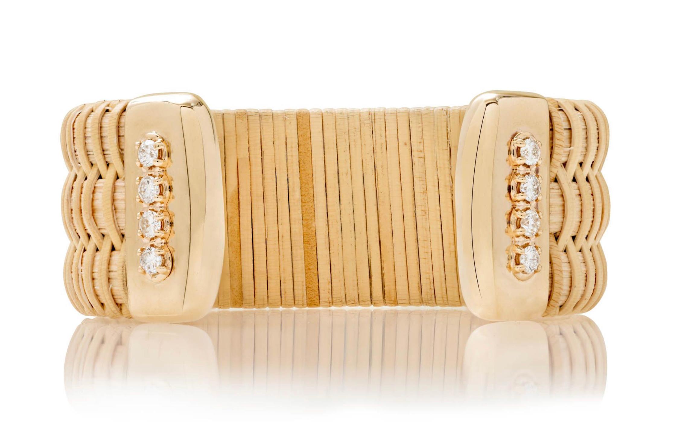 Nantucket Basket Lightship jewelry is a tradition in New England. This handmade cuff celebrates the tradition with a modern esthetic by adding gold and diamonds. Thick natural cain & rattan cuff with 10K yellow gold caps and 14K yellow gold setting