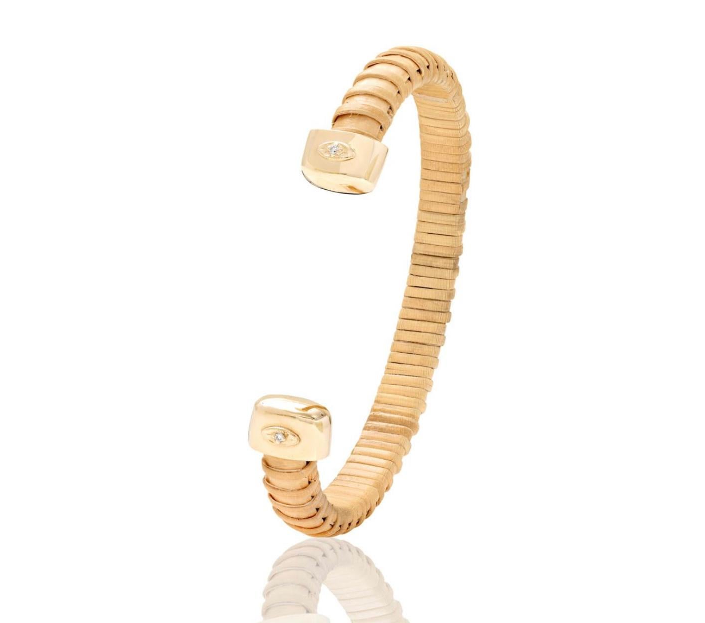 Nantucket Basket Lightship jewelry is a tradition in New England. This handmade cuff celebrates the tradition with a modern esthetic by adding gold and diamonds. Thin natural cain & rattan cuff with 10K yellow gold caps and 14K yellow gold evil eyes