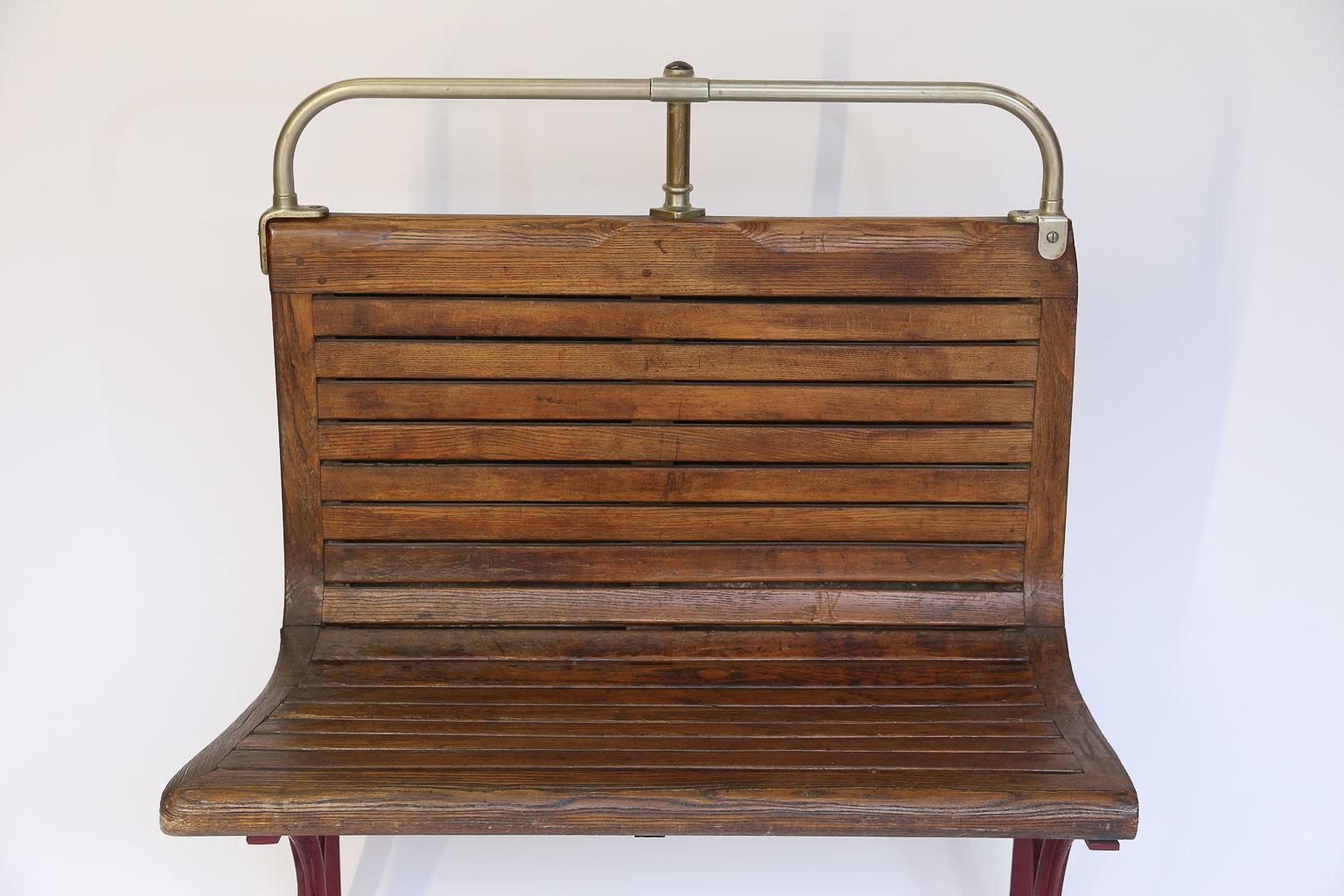 Wood slats, the rectangular, sinuous back, adorned on the reverse of an enameled iron plate with the mention 