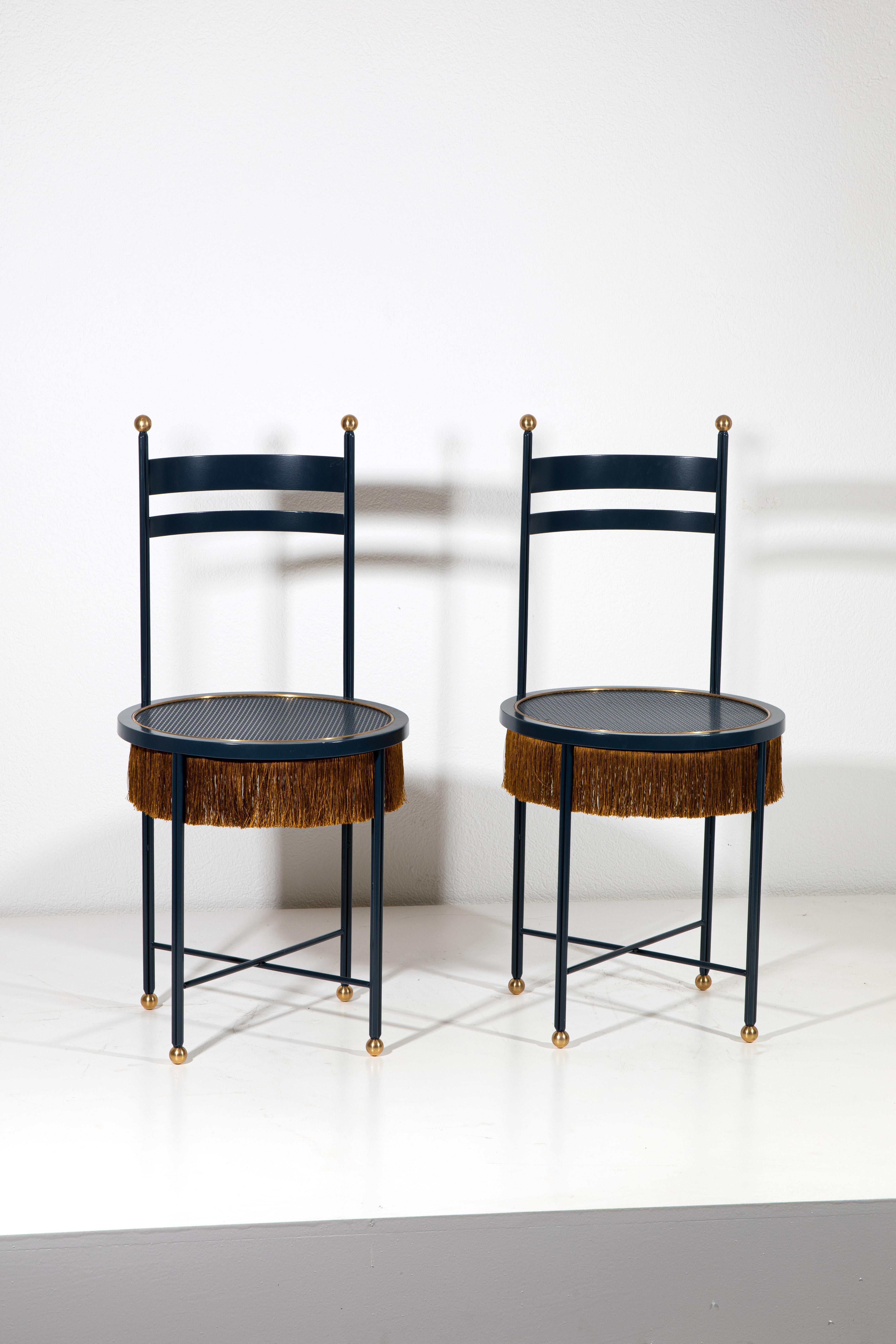 Elevate your interior with this exquisite pair of blue chairs, beautifully crafted by Dimoremilano in 2016. These striking chairs showcase a unique blend of contemporary design and playful elegance, featuring sumptuous upholstery in a vibrant blue