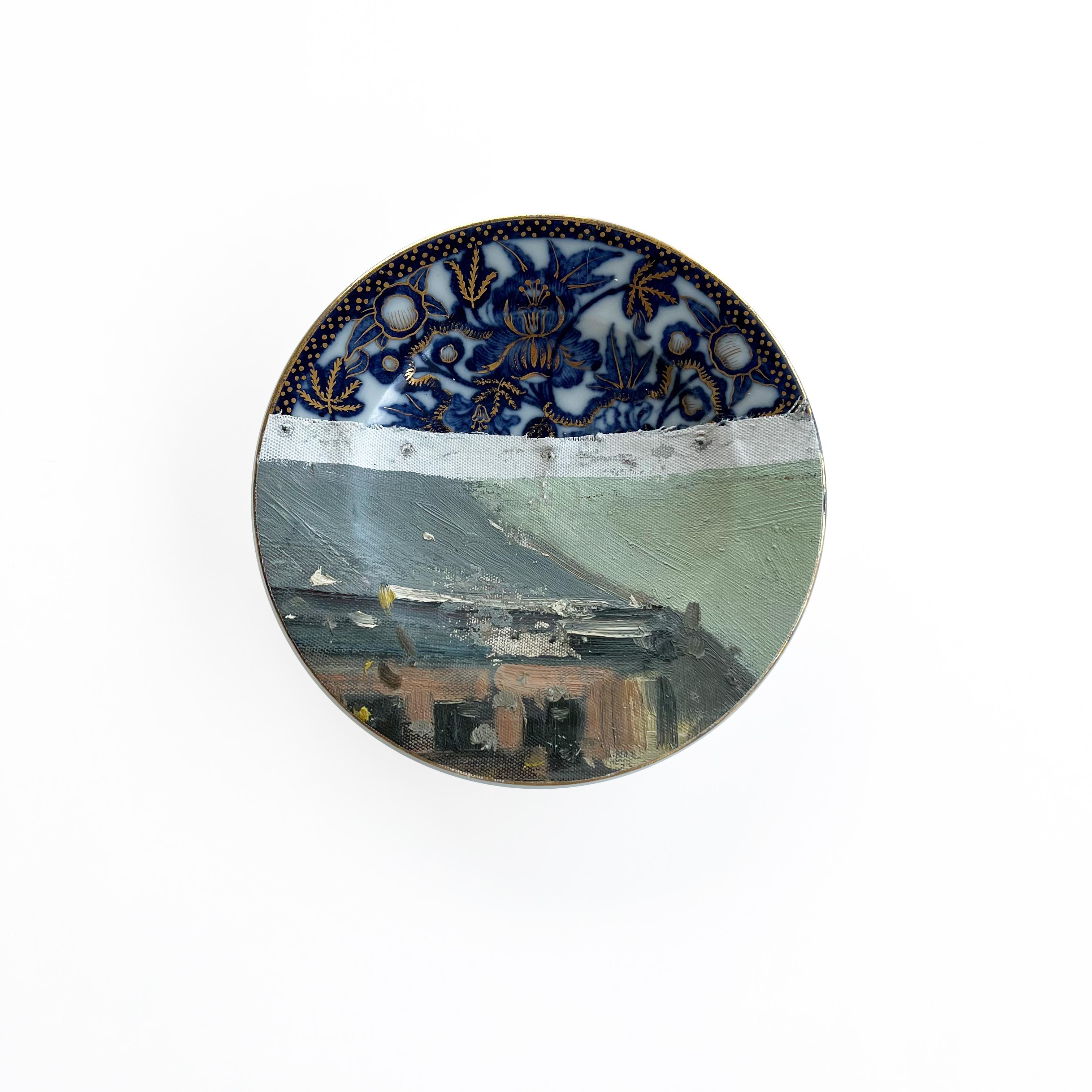 “Paris-Place Malraux” belongs to our “Altered Perspectives” series: assemblages of ceramic plates layered with a painting on canvas.
This artwork includes 6 late 19th C. European blue & white plates combined with a painting on canvas of Place André