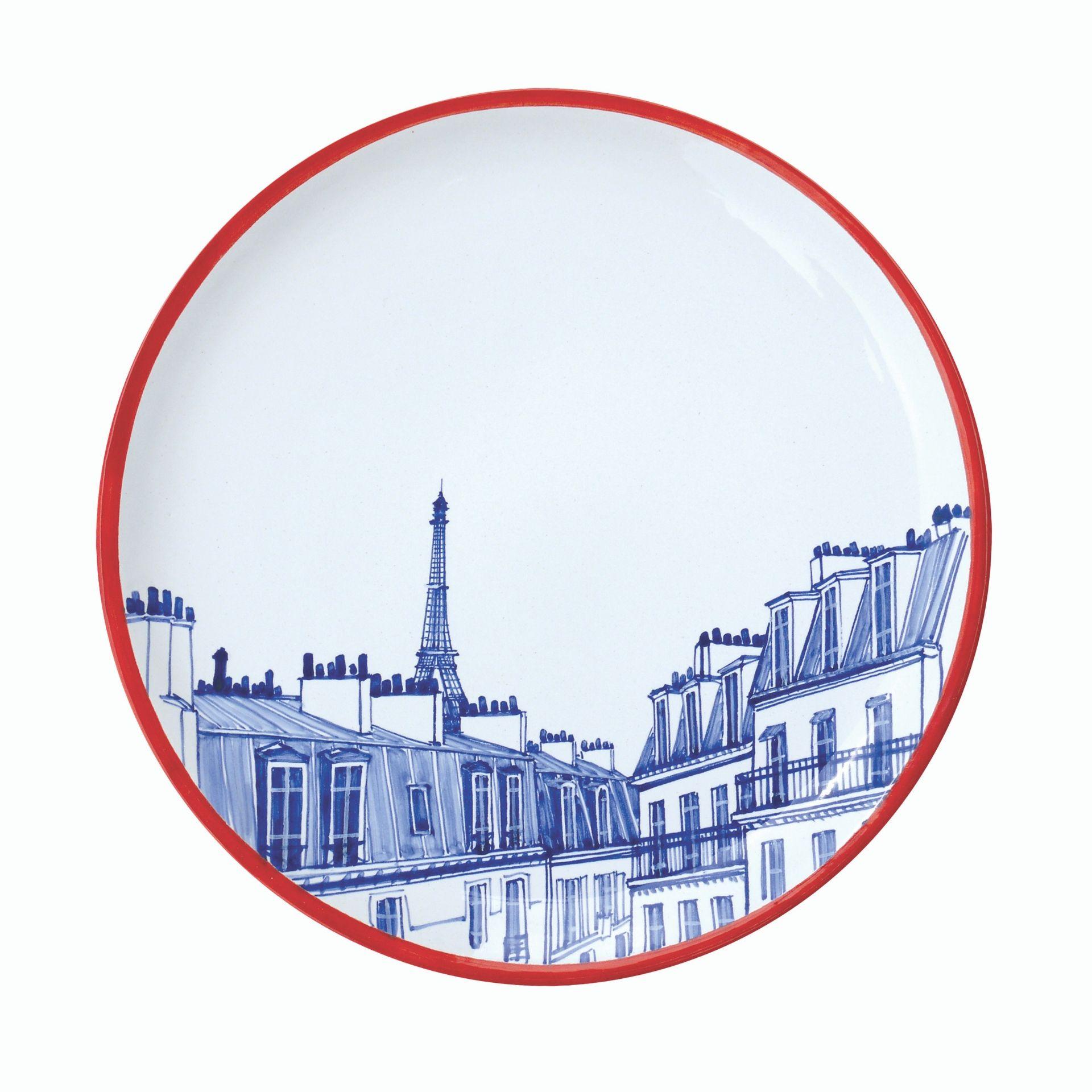 Set of 4 individually hand painted ceramic plates. Each one features a different Paris landmark: the Eiffel Tower, Montmartre, Bastille, or the Moulin Rouge. Each piece is hand painted freehand. The primary color combination of the blue décor with a