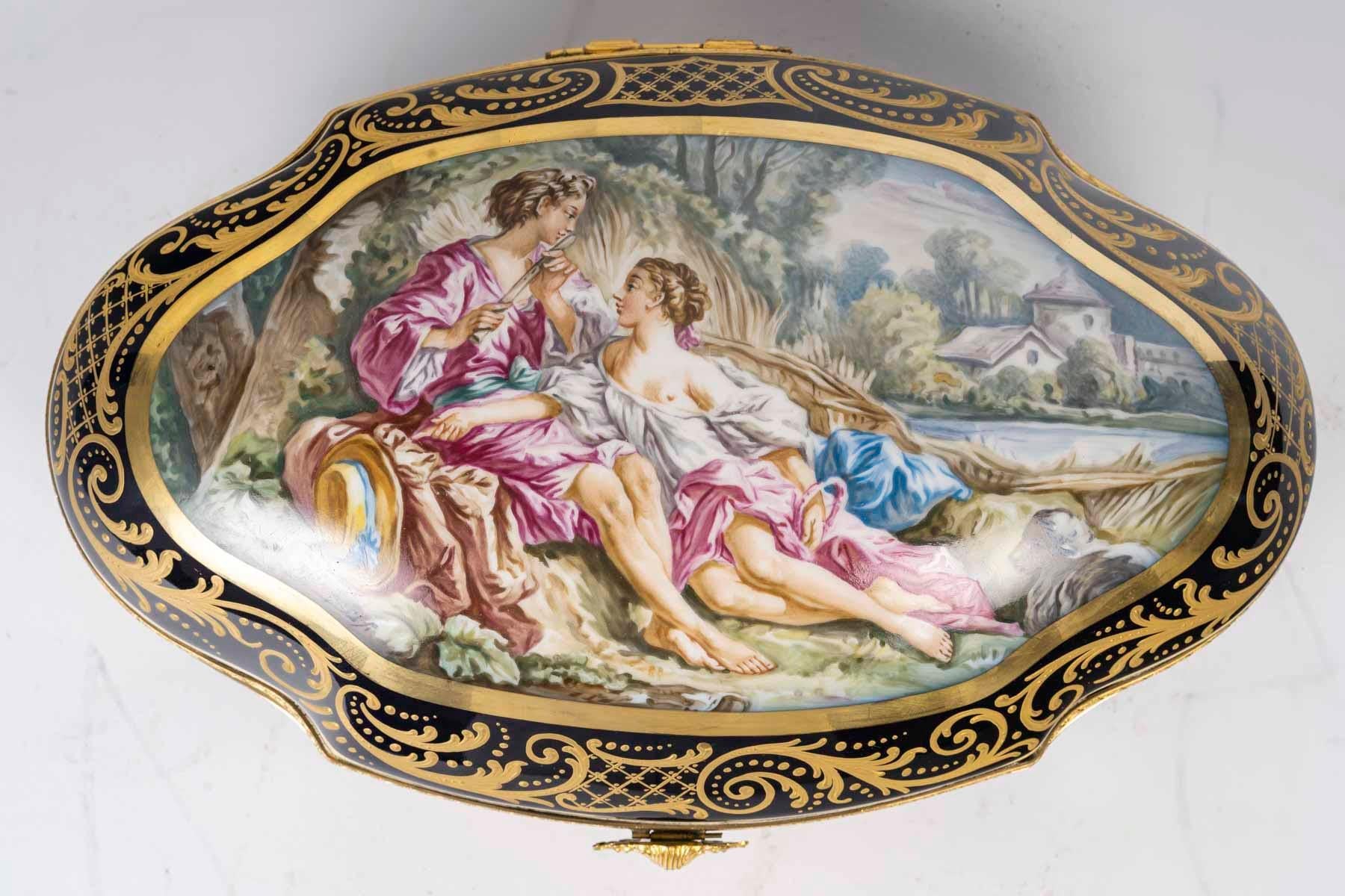 Paris porcelain box, signed Frogier, Napoleon III period.

A Napoleon III period Paris porcelain box, signed Frogier, decorated with a gallant scene.
H: 13cm, W: 35cm, D: 22cm