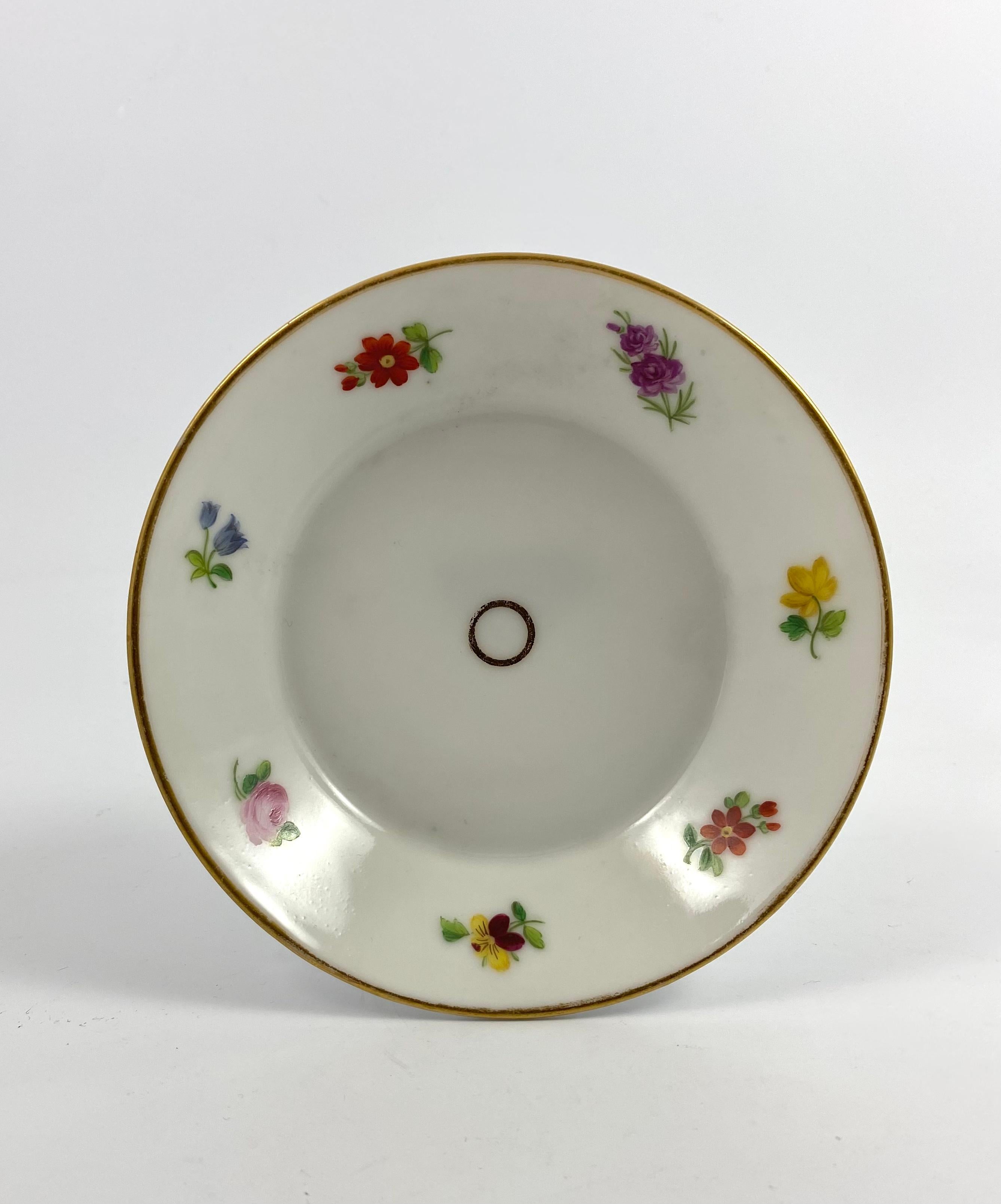 Paris porcelain coffee can and saucer, c. 1830. The coffee can painted with a large spray of flowers, with smaller sprigs around the rest of the can, between gilt lines. Similar decoration to the saucer.
Measures: Height of can – 7 cm, 2
