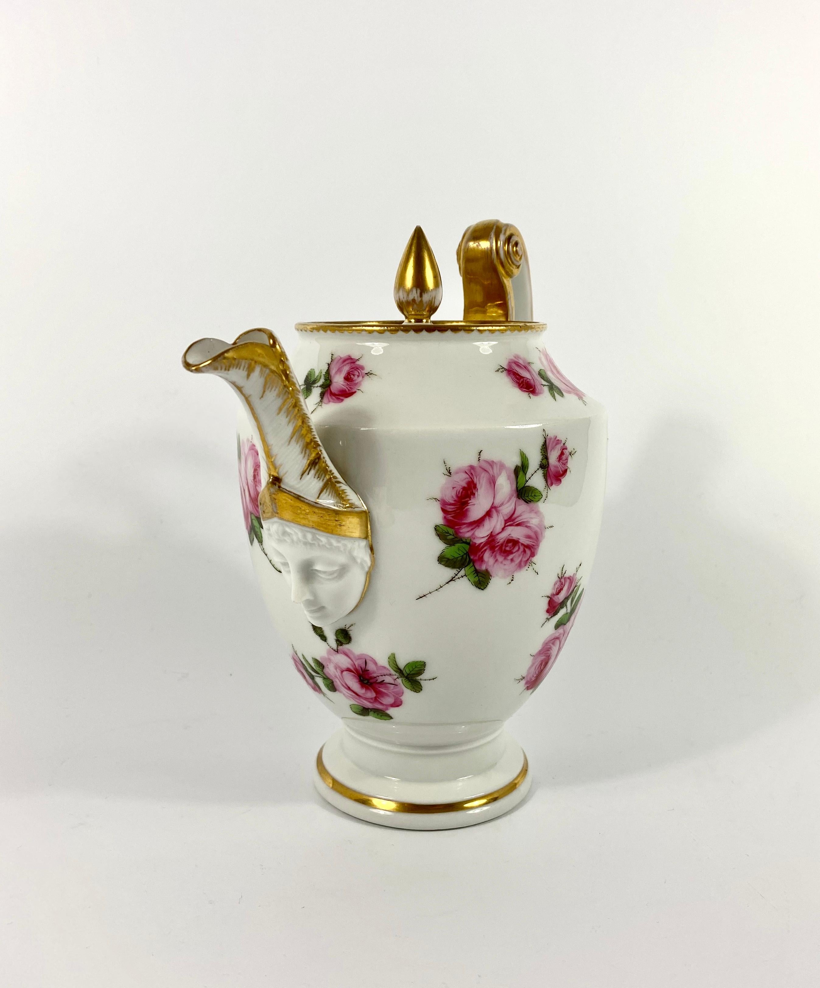 £690.00
Fine Paris porcelain ‘Empire’ coffee pot, circa 1820. Possibly decorated in London with beautifully hand painted sprays of roses to the body, and the cover. The moulded scroll shaped handle, terminating in a stylized acanthus leaf motif,