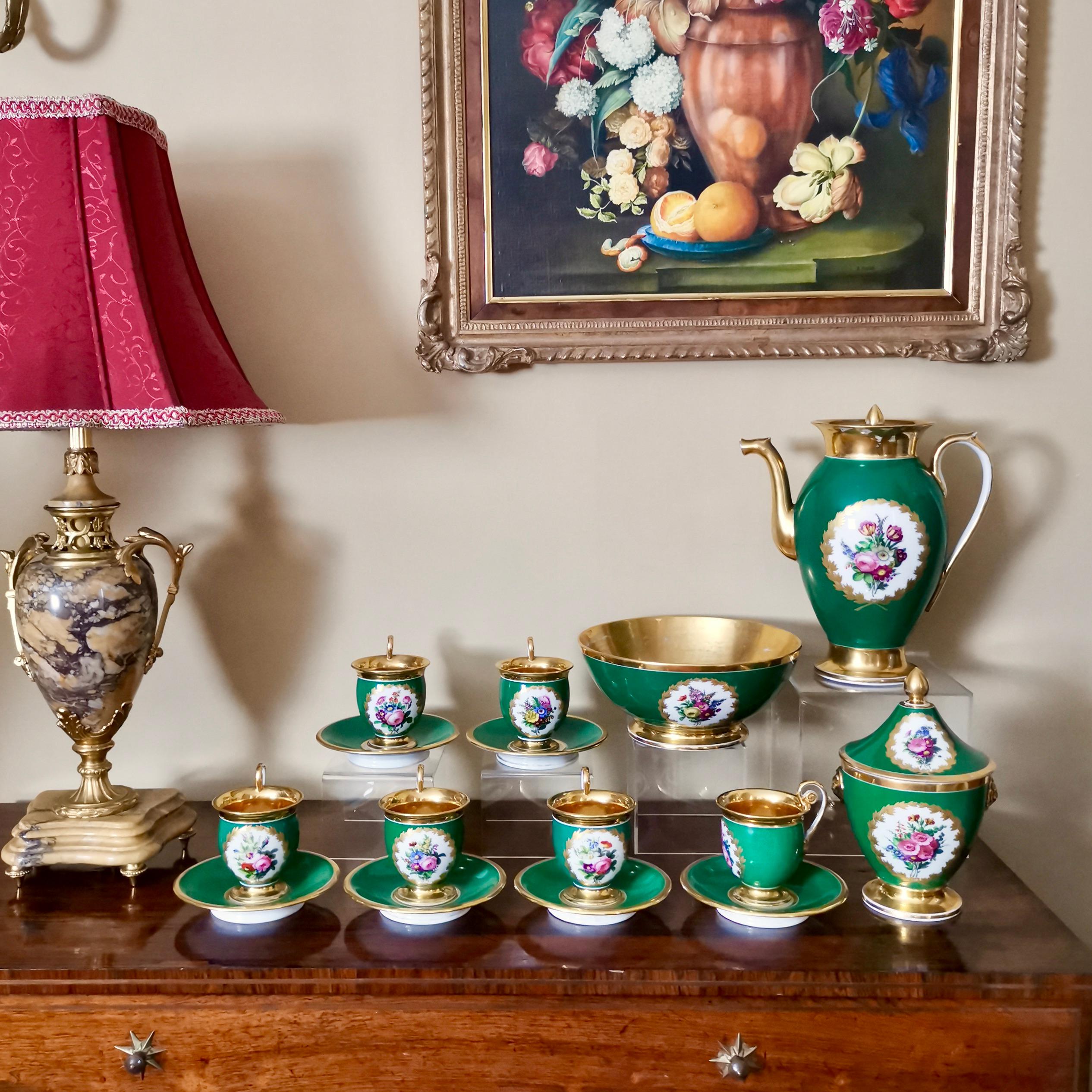 This is a stunning coffee service made in the Empire style by a Paris factory in circa 1820. All items are decorated with a beautiful emerald green ground, flower posies and gilt.

There were many porcelain factories in early 19th century Paris,