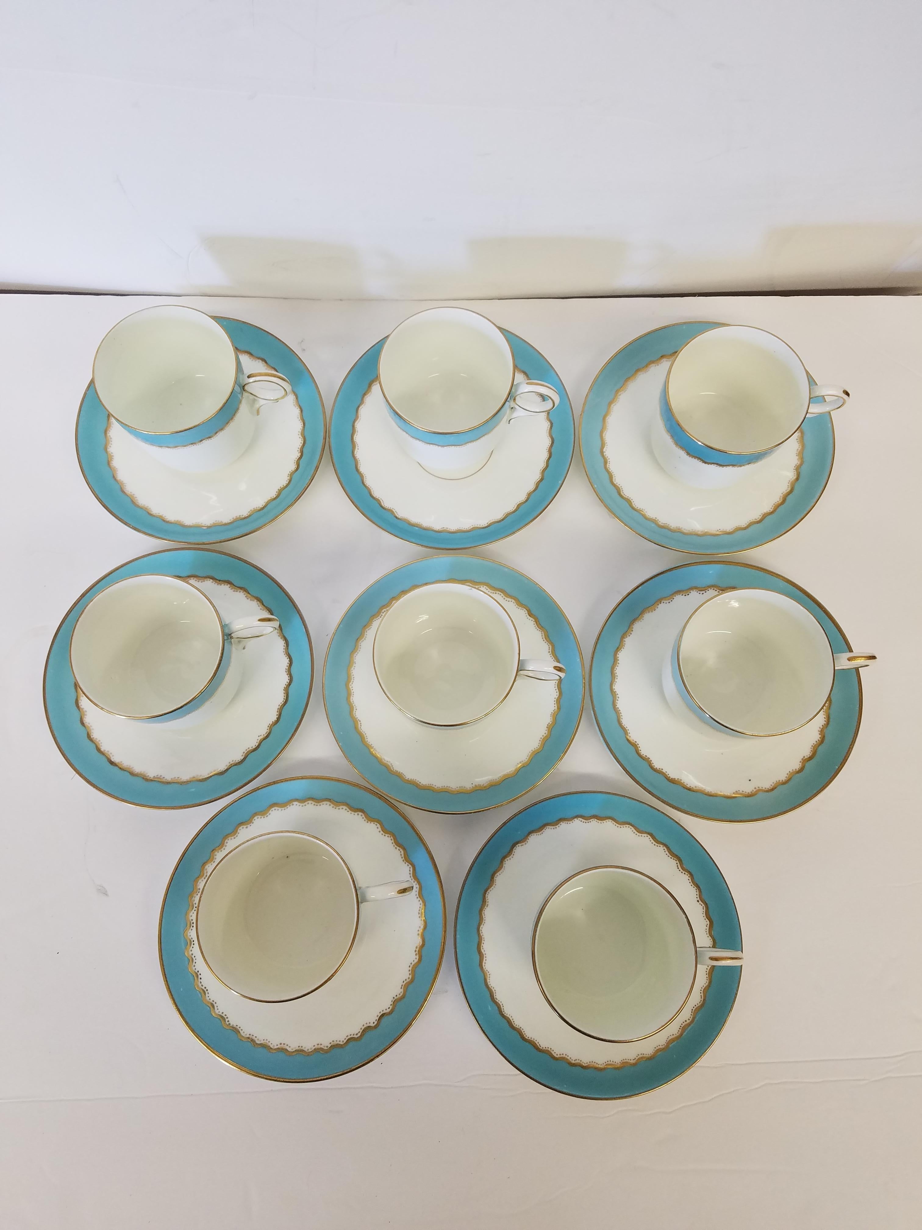 A Set of 8 French demi tasse cups and saucers in a robins egg blue with gilt trim. Turn of the century
Measures: 5.5 W x 3.5 H.