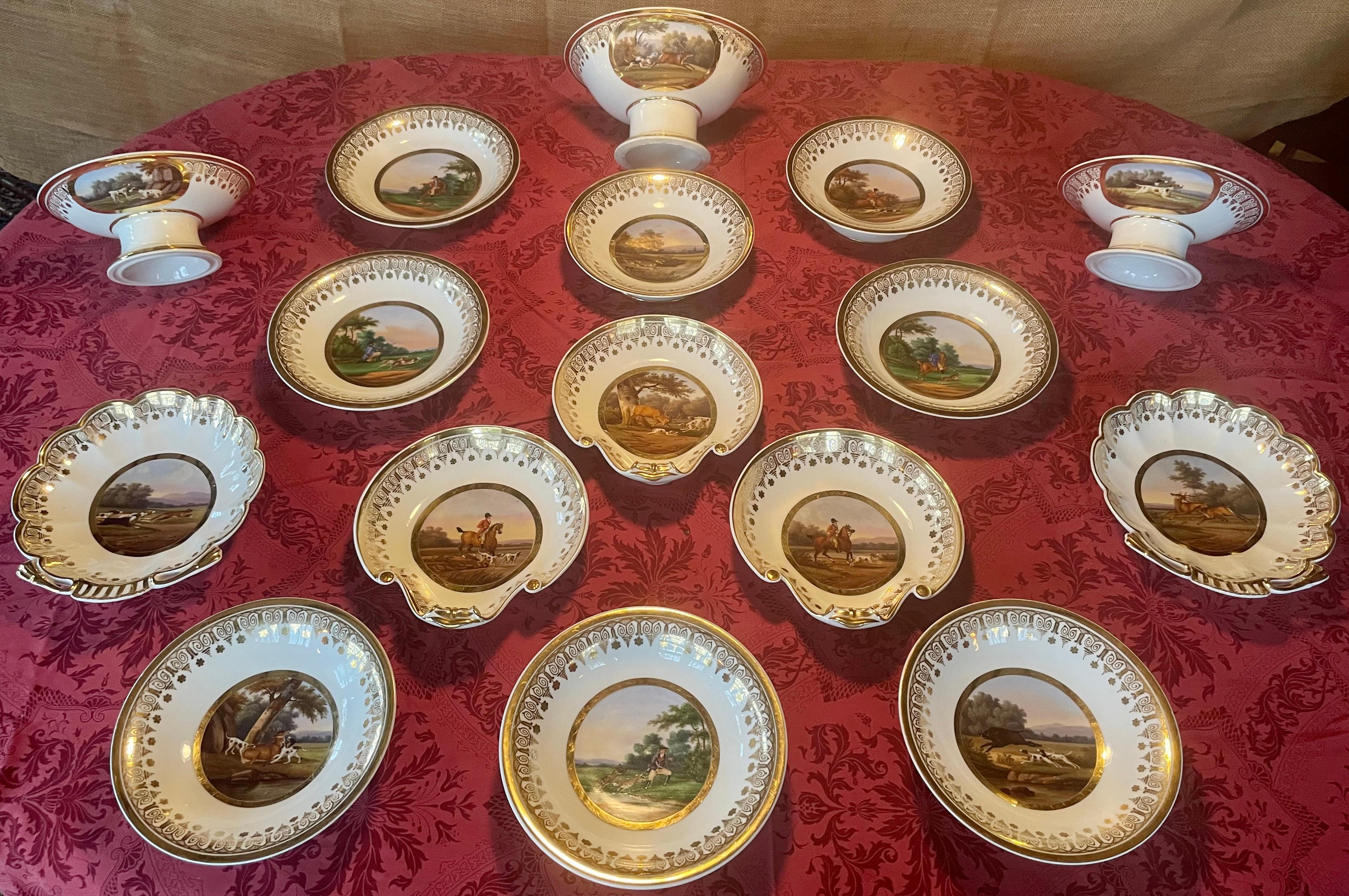 Paris porcelain gilt banded hunting service. Set of sixteen complementary serving dishes with hunt paintings attributed to Jacques François Joseph Swebach, a painter for Serves porcelain as well as Royal Russian Porcelain manufactory; his work found
