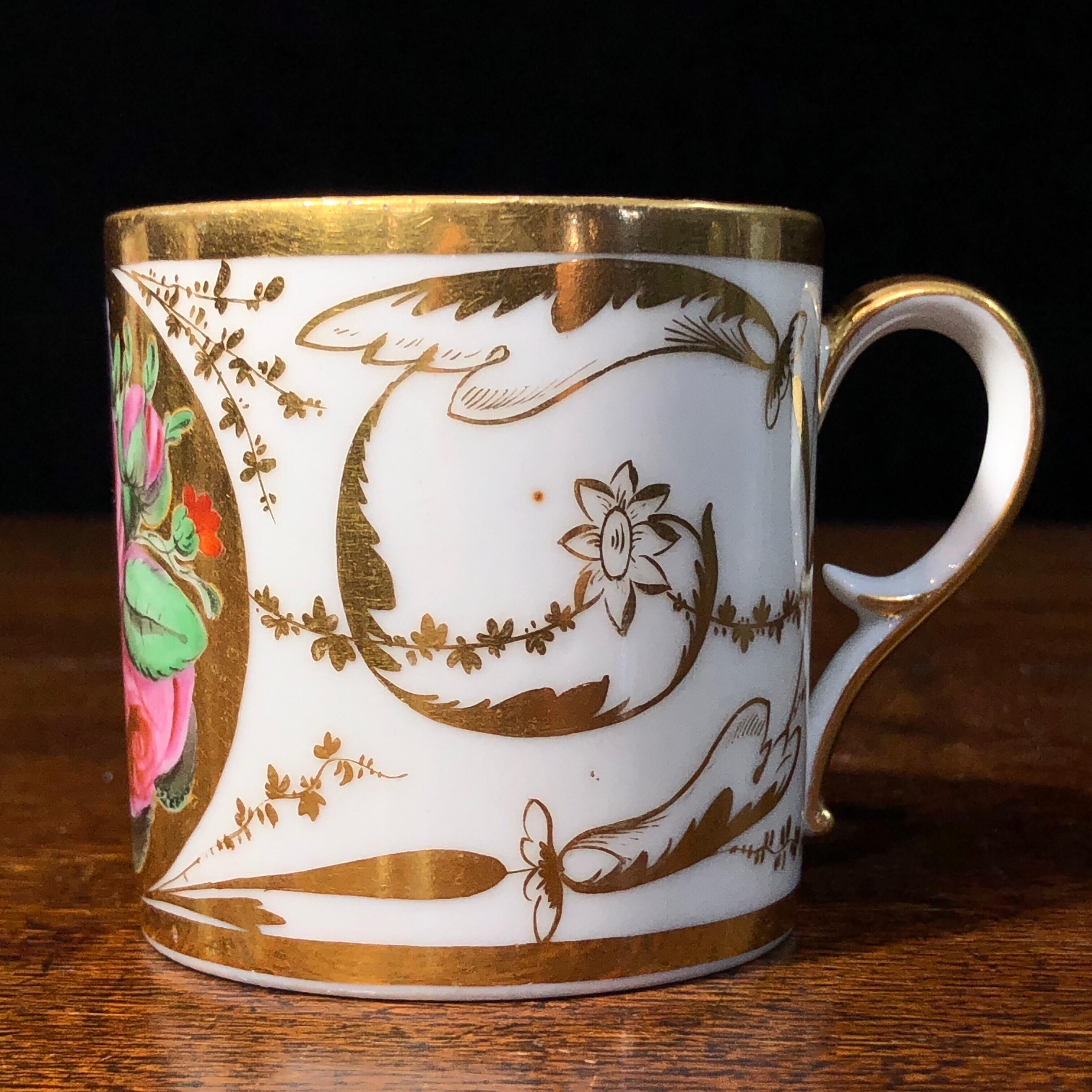 Paris porcelain coffee can, of straight sided form, boldly painted with a large flower group on a gold ground, within elaborate gilt classical scrolls.
Marked ‘Manteau’ in gold script, for the decorating studio of Manteau ran at Rue Saint-Honoré,