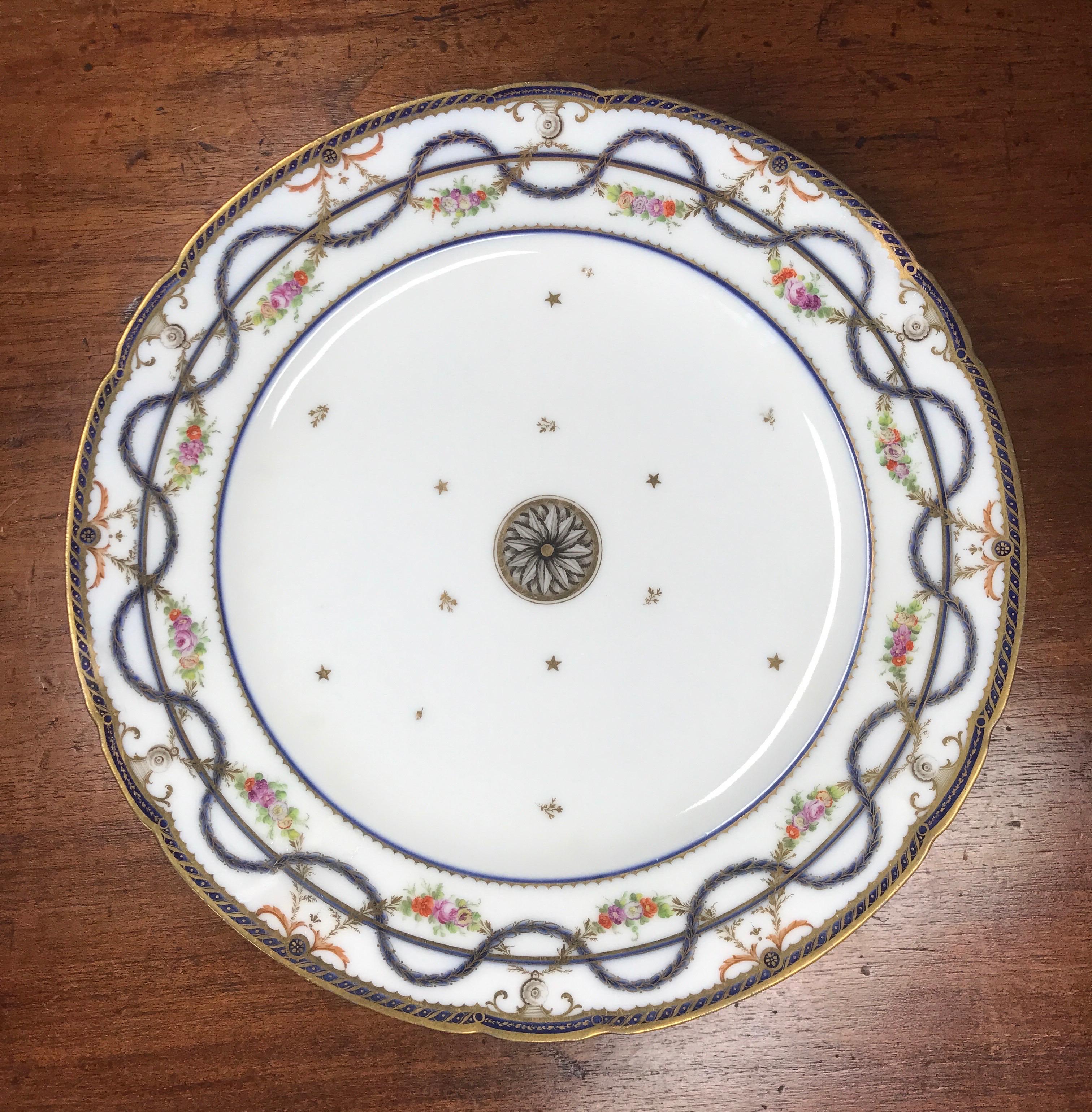 A handsome plate from Duc d'Angouleme's factory, decorated in the classical taste with gilt underglaze swags, rose garlands, scattered gilt stars and floral sprigs, surrounding the central monochrome rosette.

Duc d'Angouleme
Red stencil