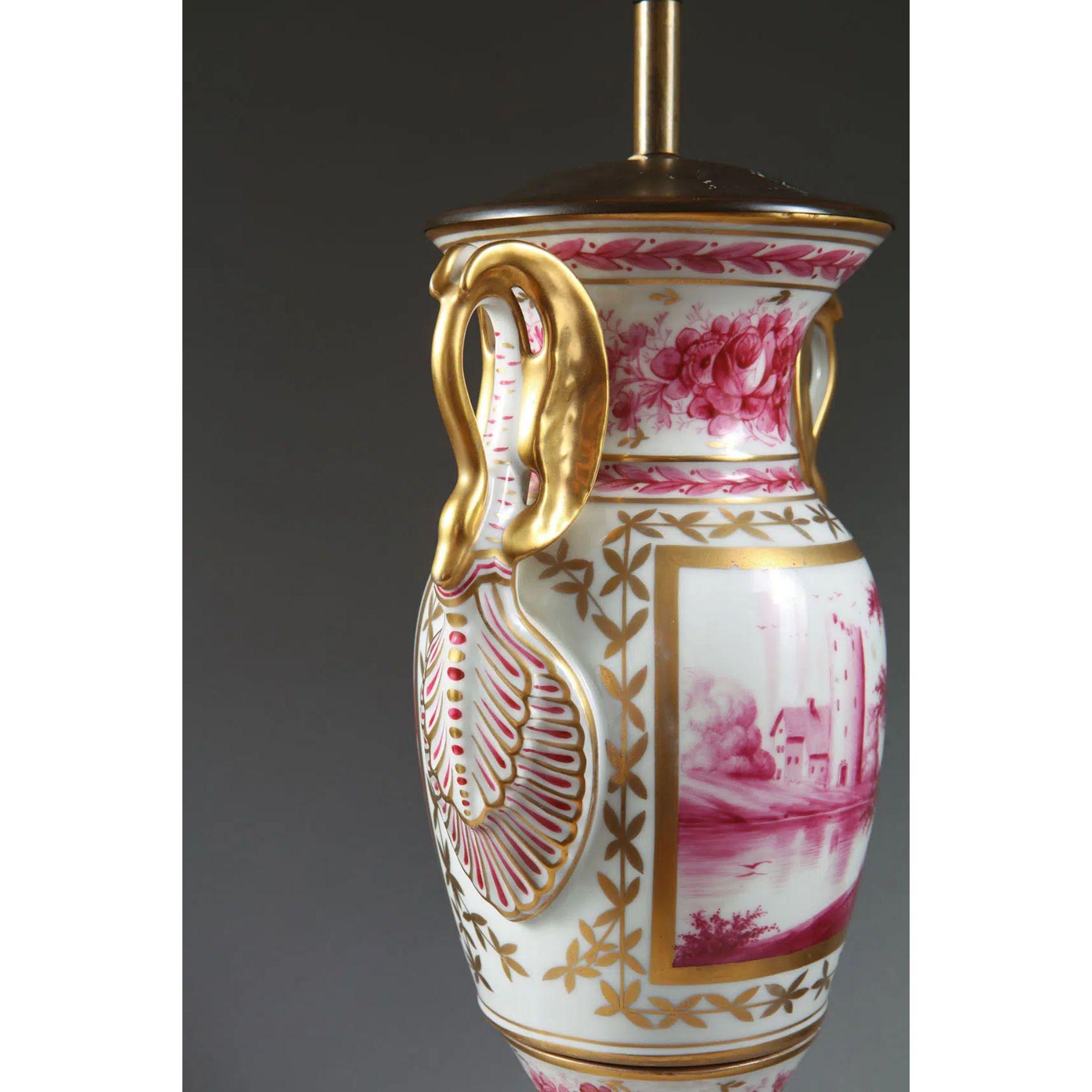 Paris Porcelain Pink and Gold over White Glazed Vase Mounted as a Table Lamp

Paris Porcelain monochrome pink pigment underglaze depicting bucolic scenes, the vases with gilt swan handles, now mounted as a table lamp and standing on a square water
